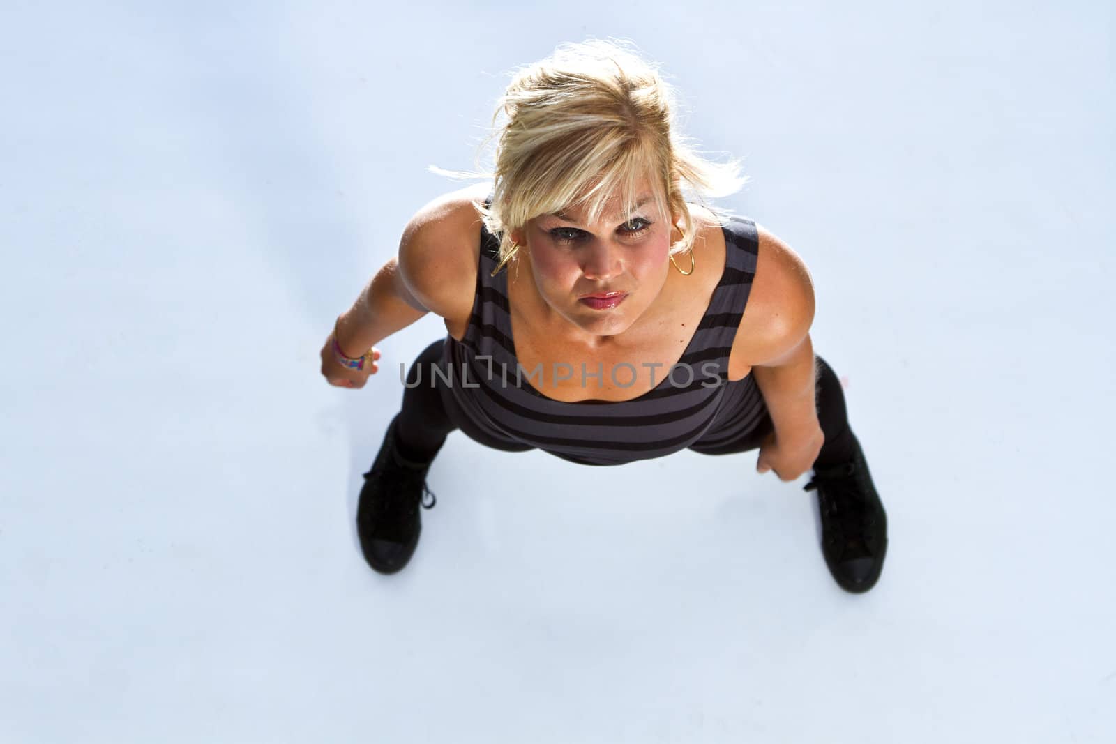 Blonde cute girl dancing shot with flash