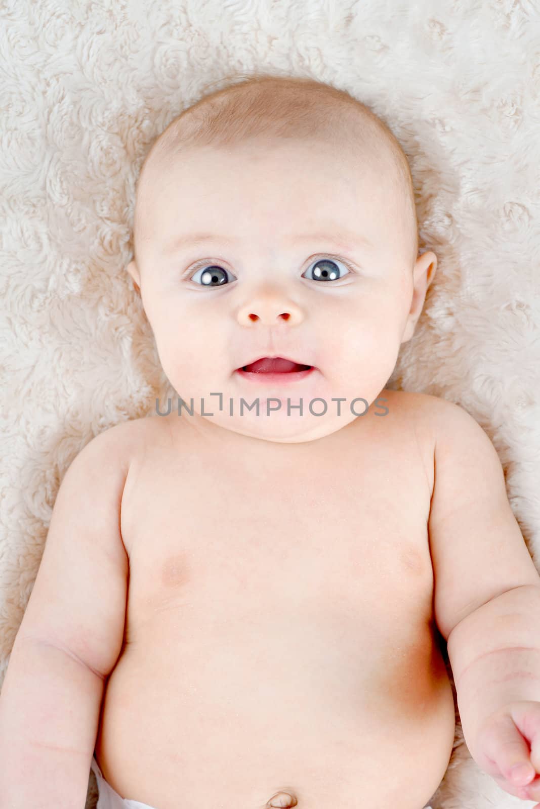 Portrait of cute 3 months old baby looking at camera