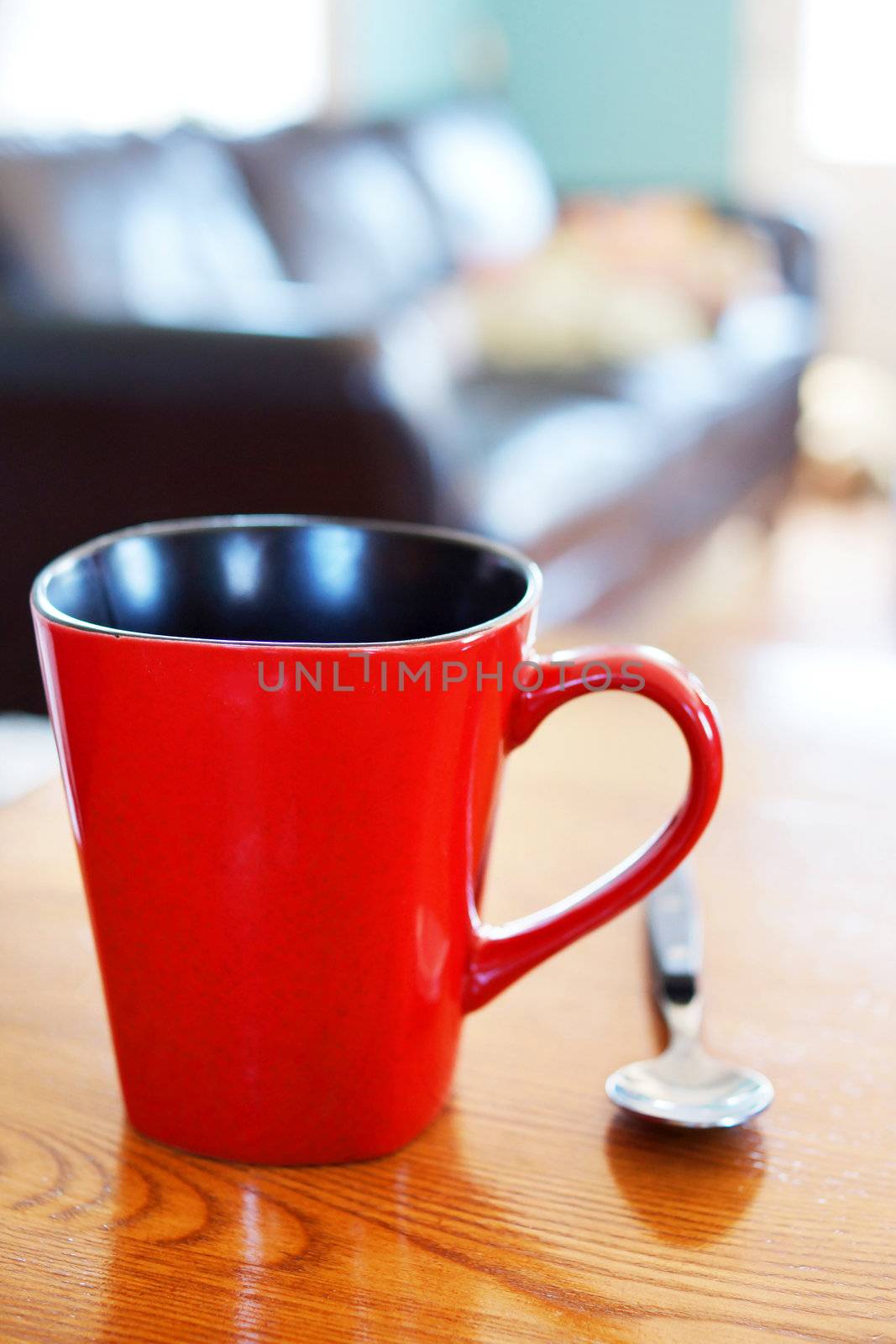 Red coffee mug or cup in casual home interior
