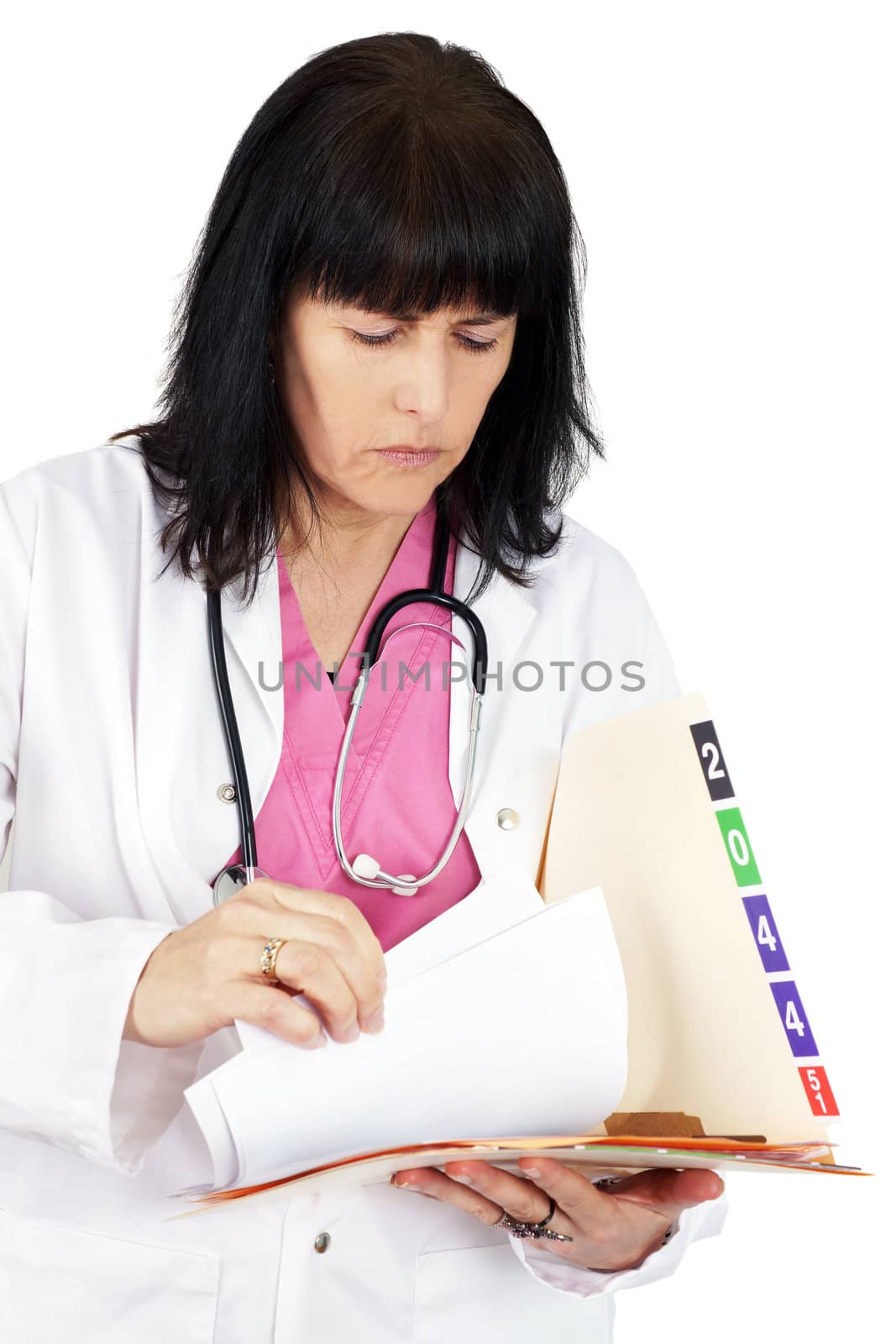 Doctor looking at medical file by Mirage3
