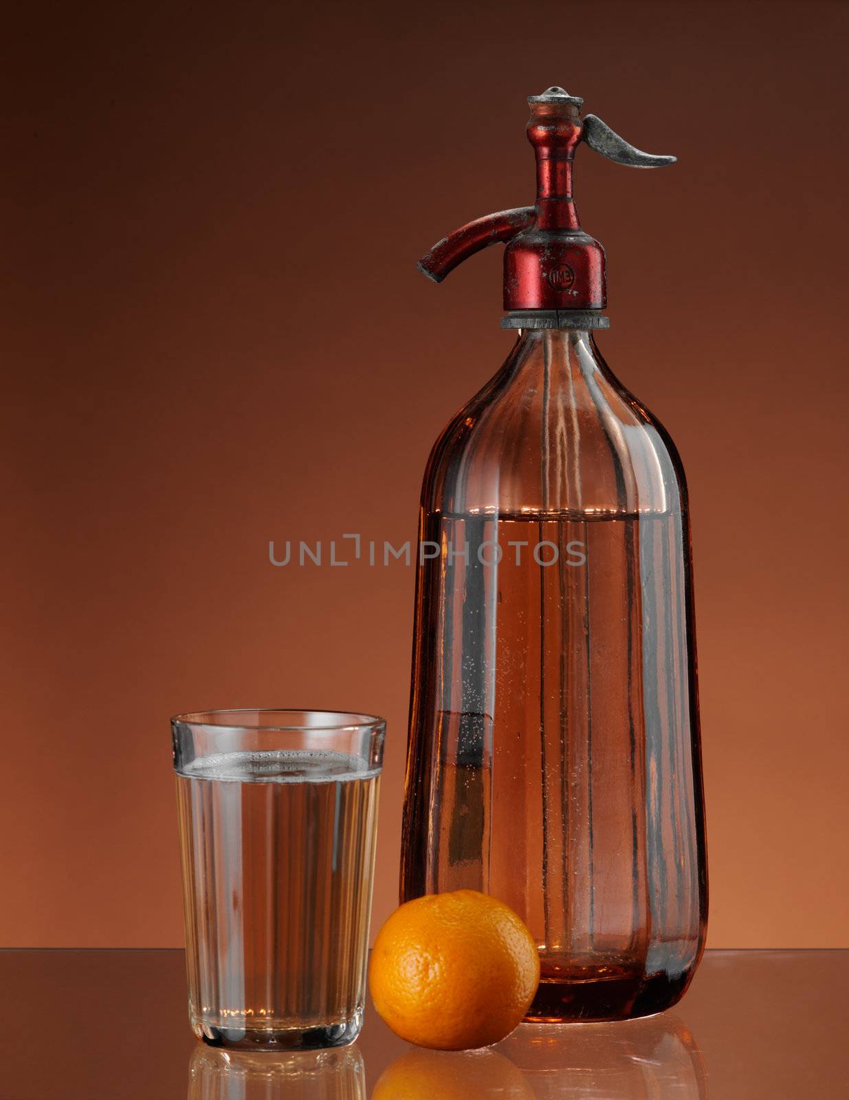 glass and bottle with fresh carbonated water 