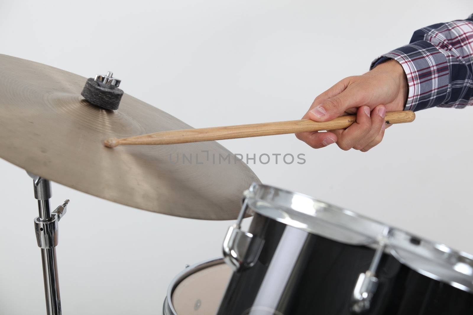 Drummer hitting a cymbal