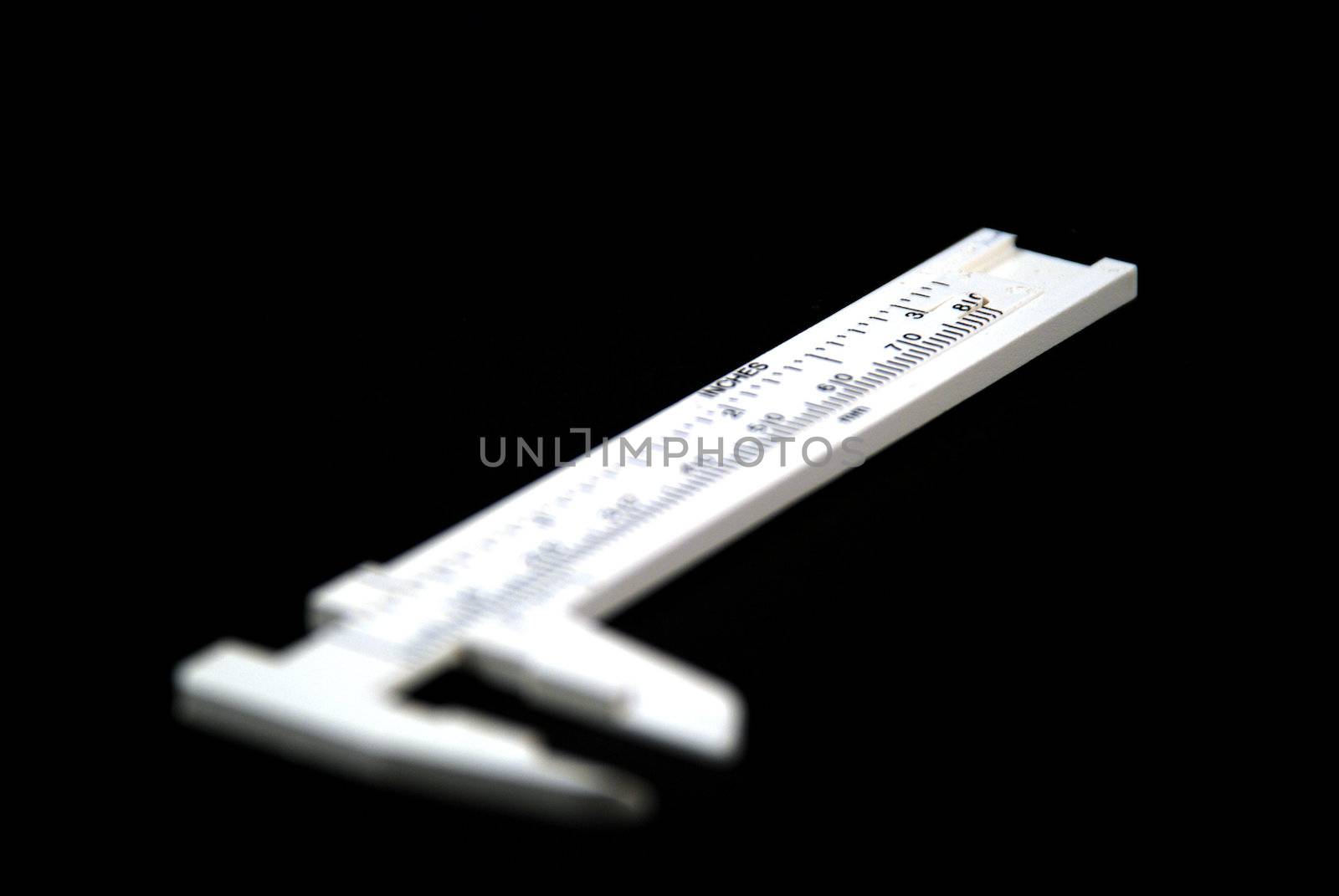 stock pictures of whilte calipers over black background