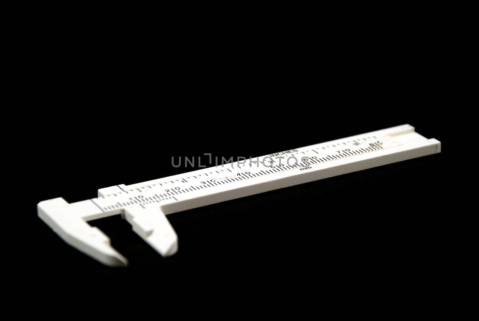 stock pictures of whilte calipers over black background