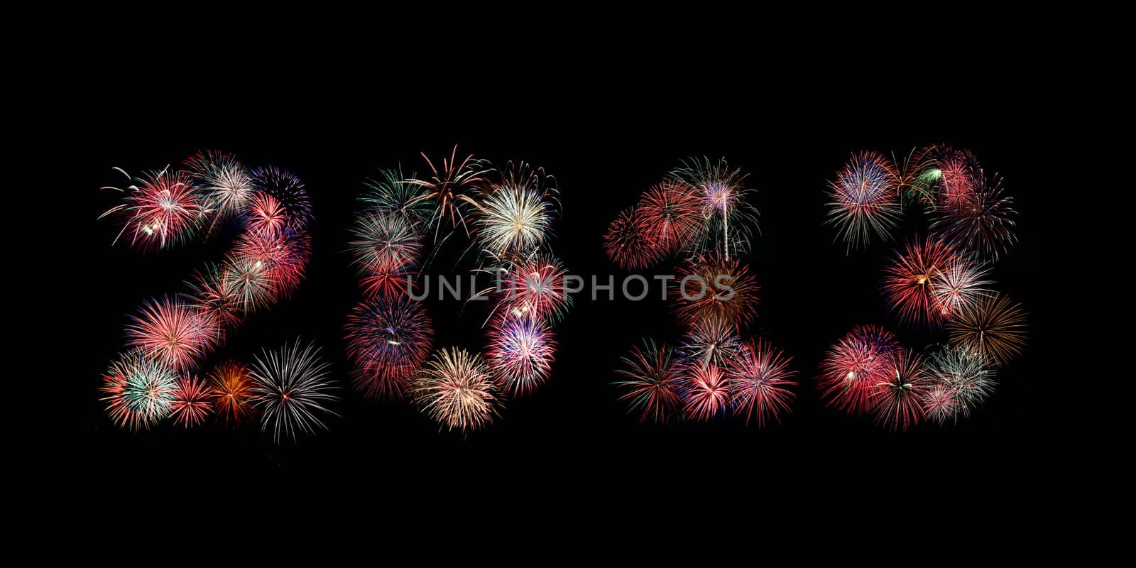 Multiple bursts of colorful fireworks were used to write out the new year 2013 against a black background