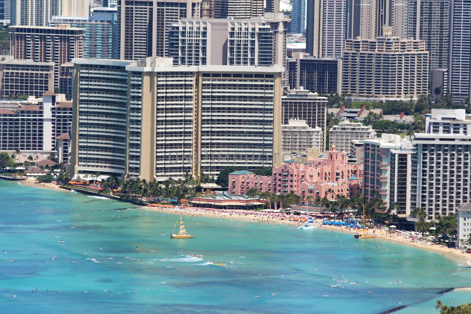 Close-up aerial view of Waikiki Beach and nearby buildings of Honolulu, Hawaii