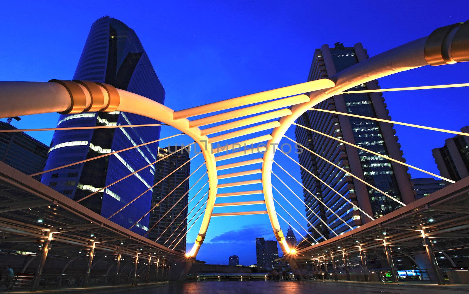 skywalk at bangkok downtown square in business zone at dusk