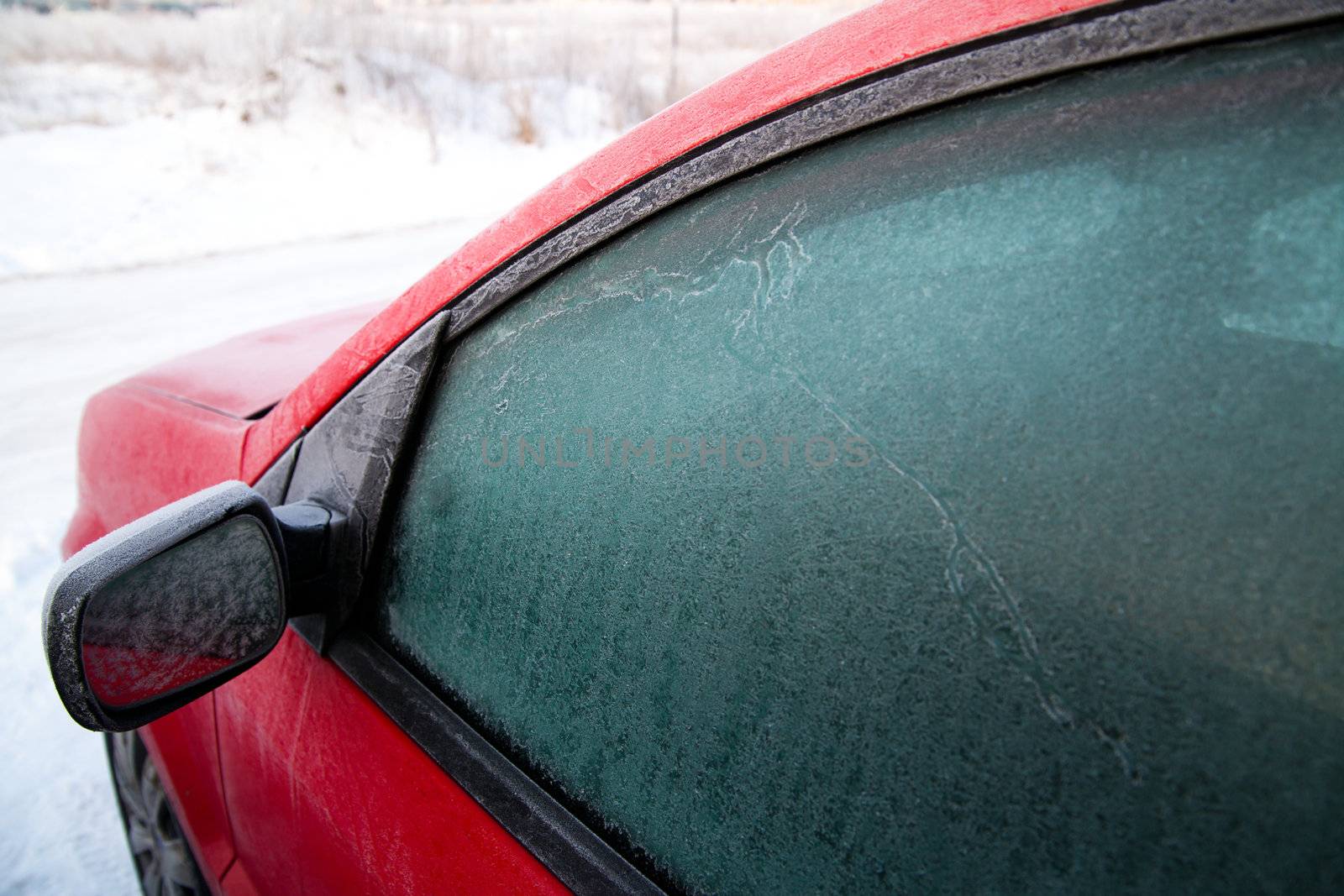 Frozen car window during winter morning
