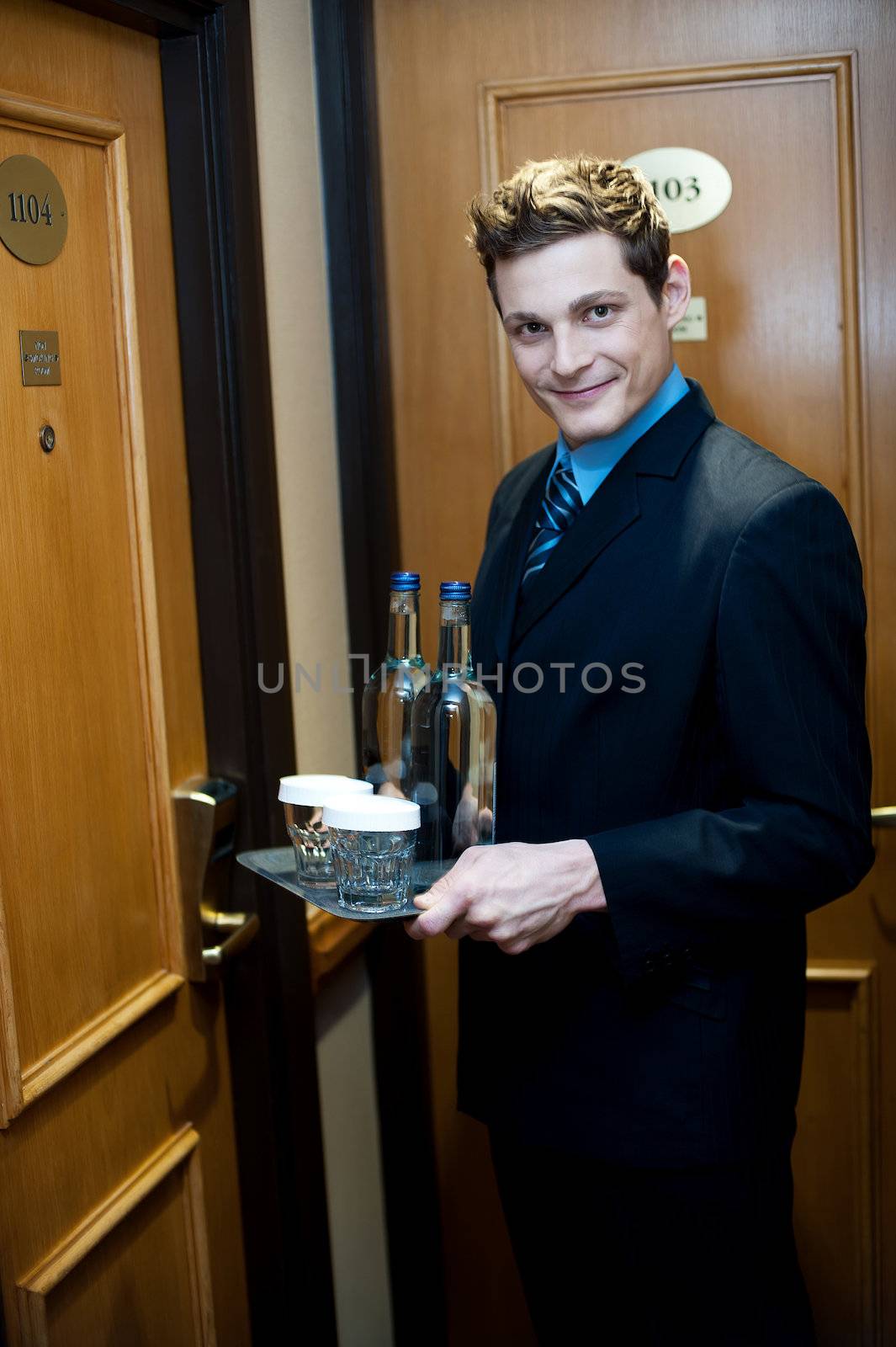 Beverages are ready to be delivered by a well dressed male executive