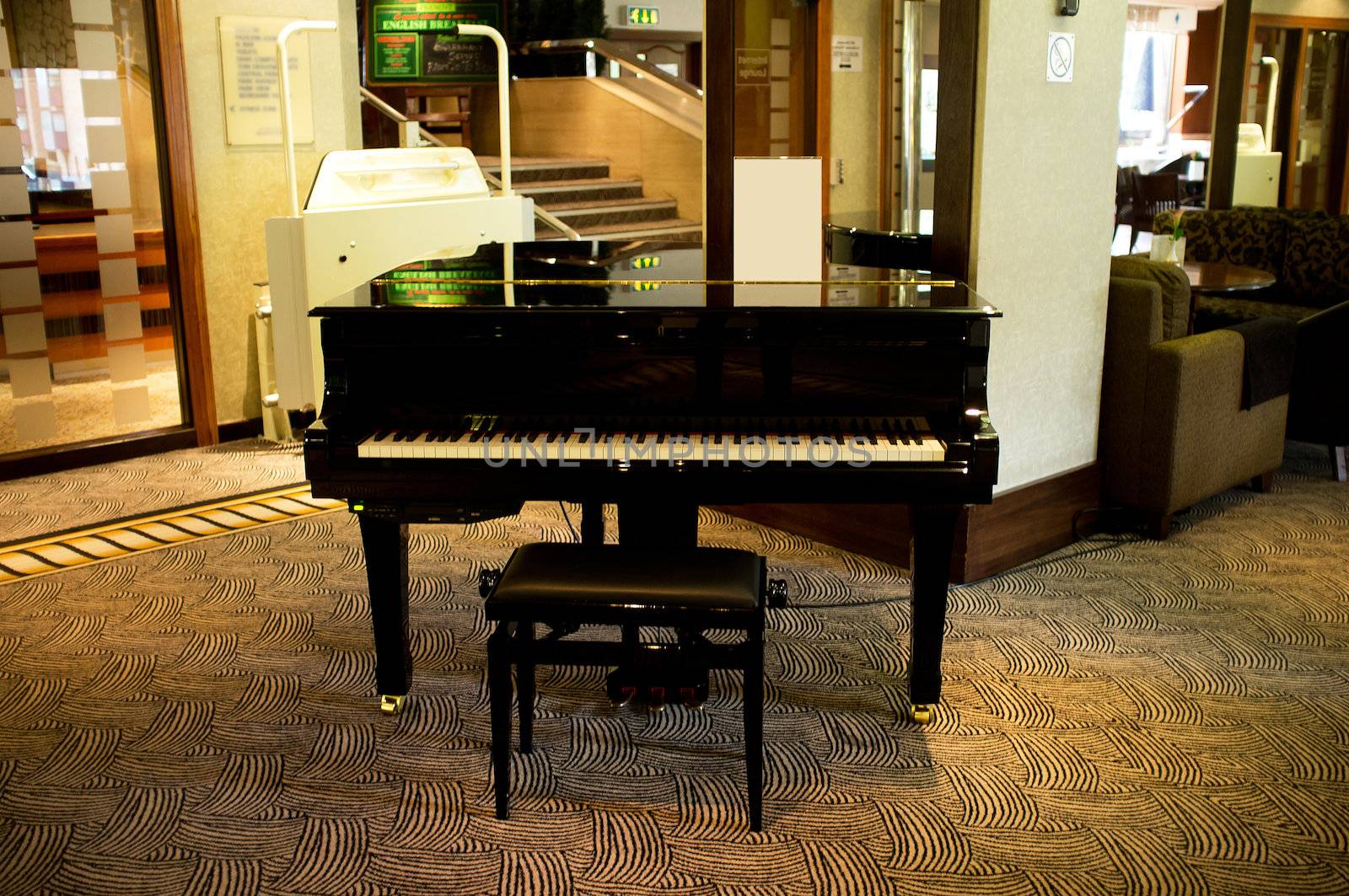 Piano in the middle of massive lounge by stockyimages