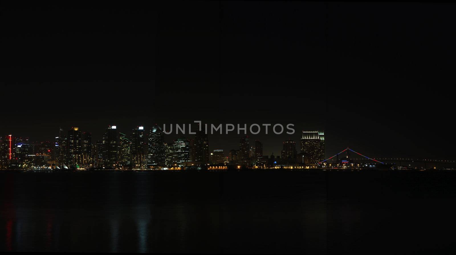 Panoramic view of the skyline of San Diego from the water at night