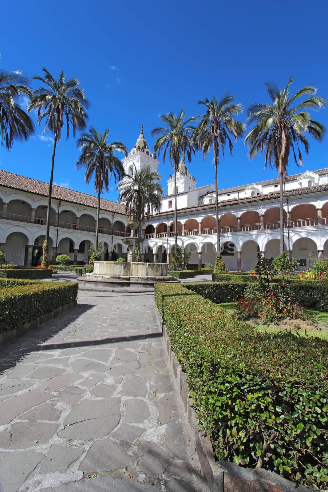 Courtyard gardens, fountain and dome of the church and monastery of San Francisco in Quito, Ecuador