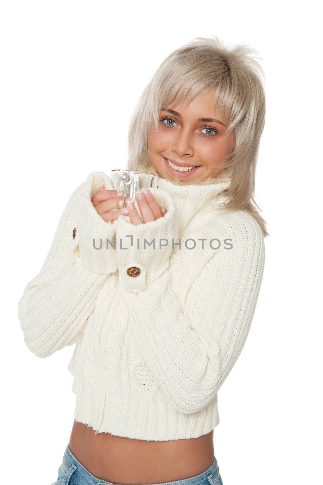Beautiful woman in white sweater holding a cup.
