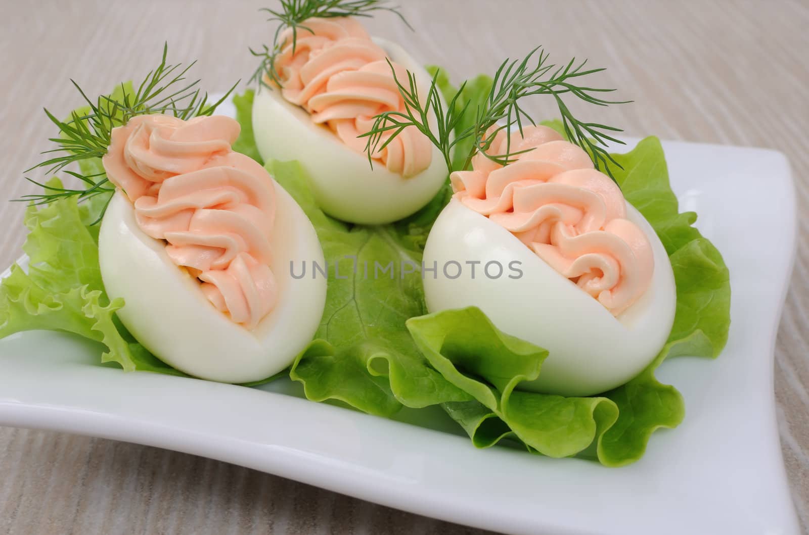 Eggs stuffed with salmon pate in lettuce leaves