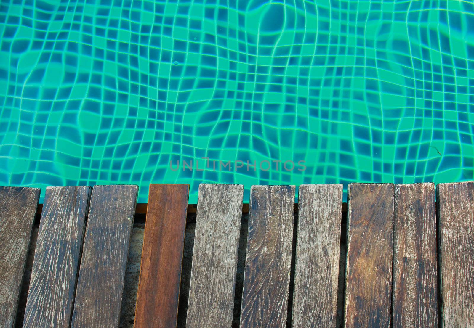 Swimming pool and old wooden deck by nuchylee