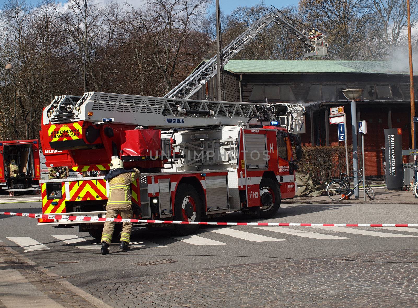 COPENHAGEN - APR 28: Firemen controls fire at The Museum of Danish Resistance 1940 -1945 on April 28, 2013 in Copenhagen, Denmark. It took 10 hours to put off the fire which started at 1:45 A.M.