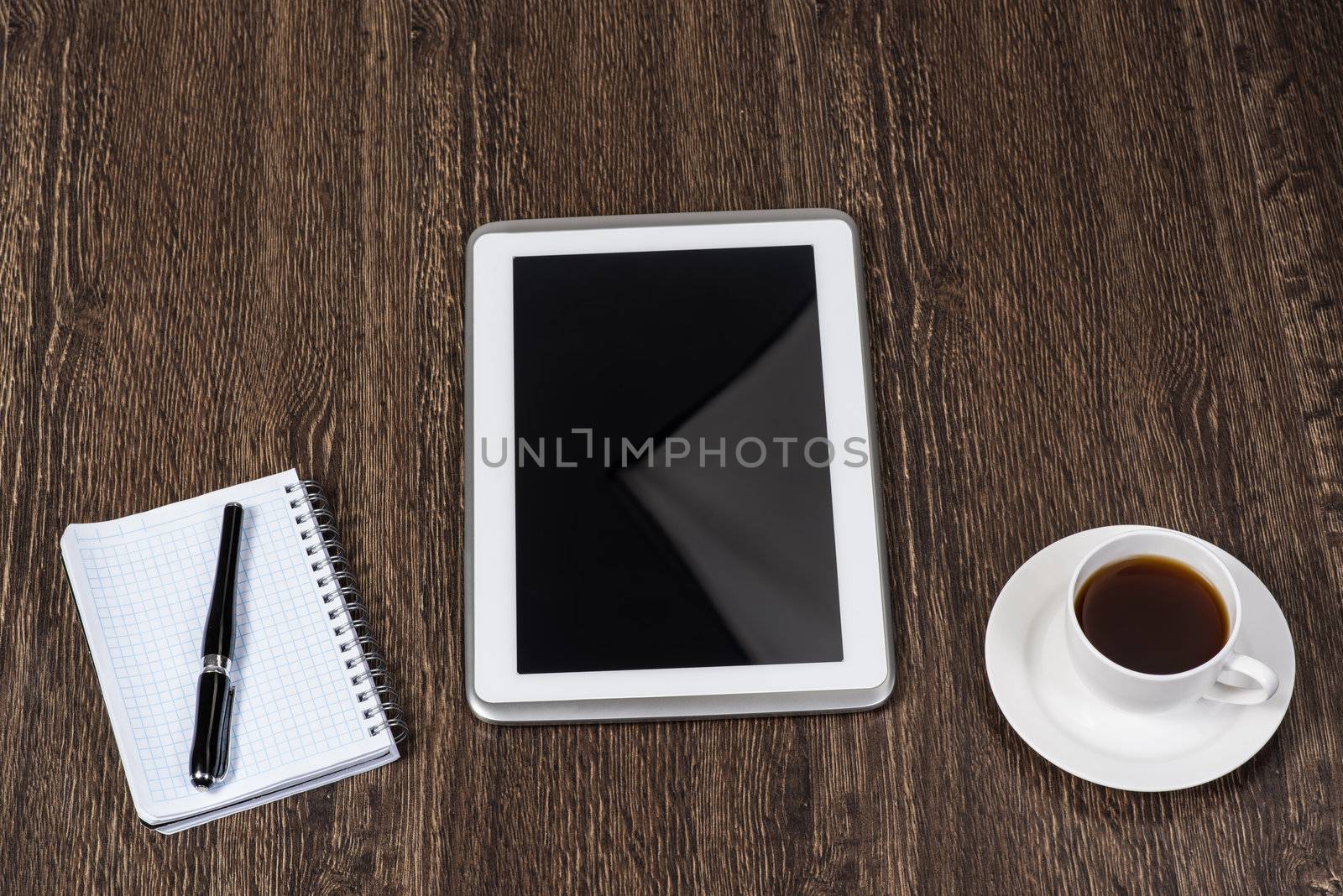 pen, coffee and tablet on the table, workplace businessman