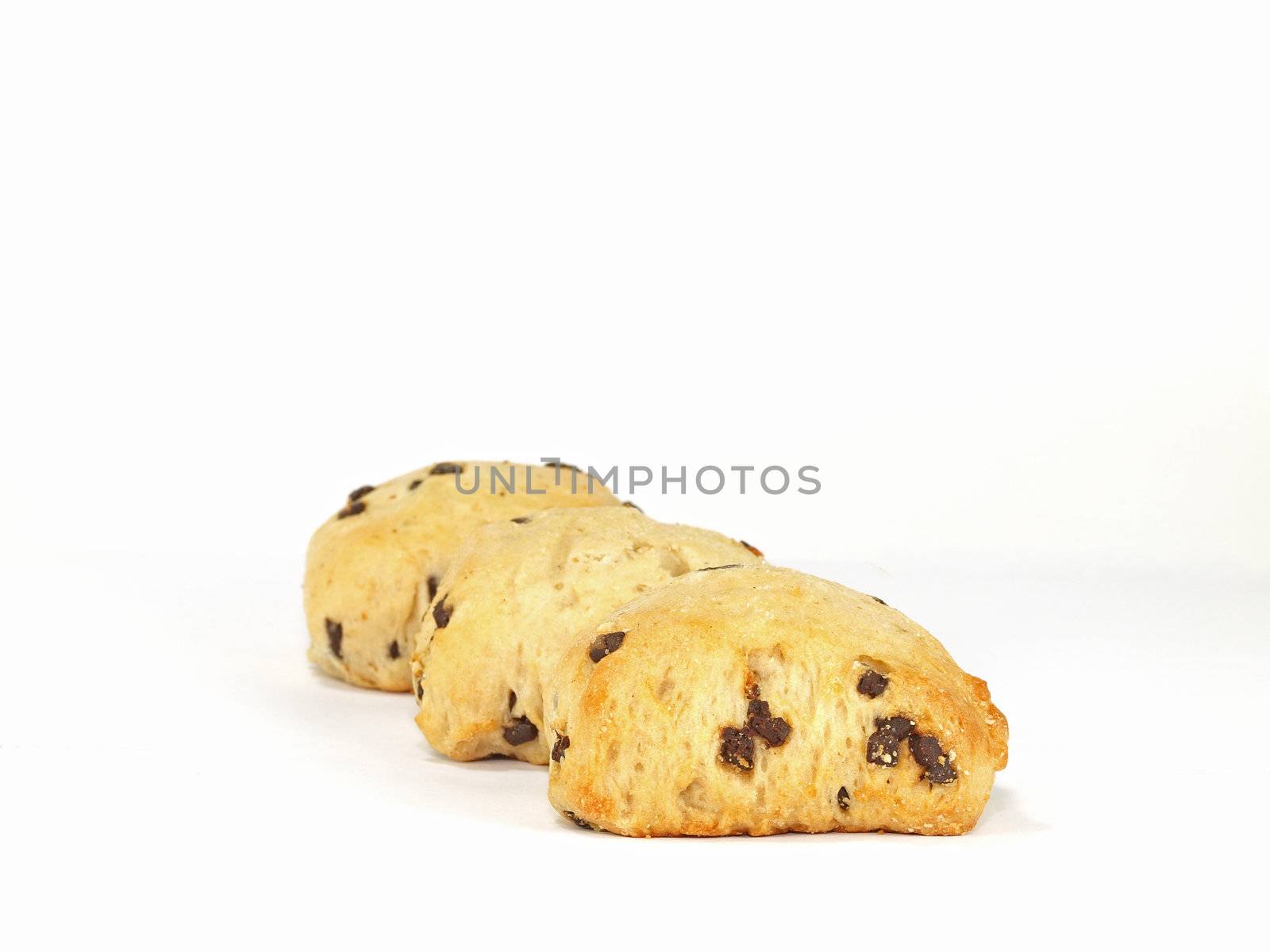 three spongy chocolate chip scones on white background