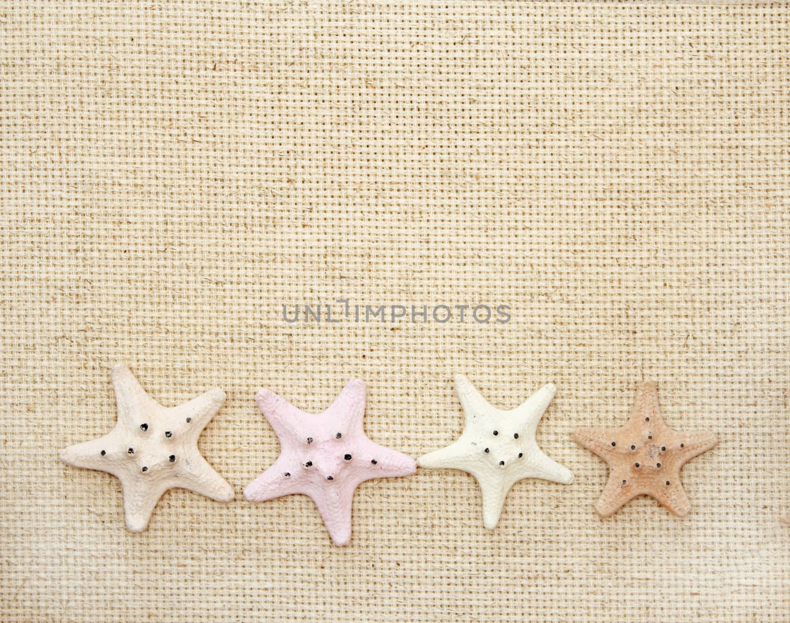 Starfishes on canvas texture by frenta