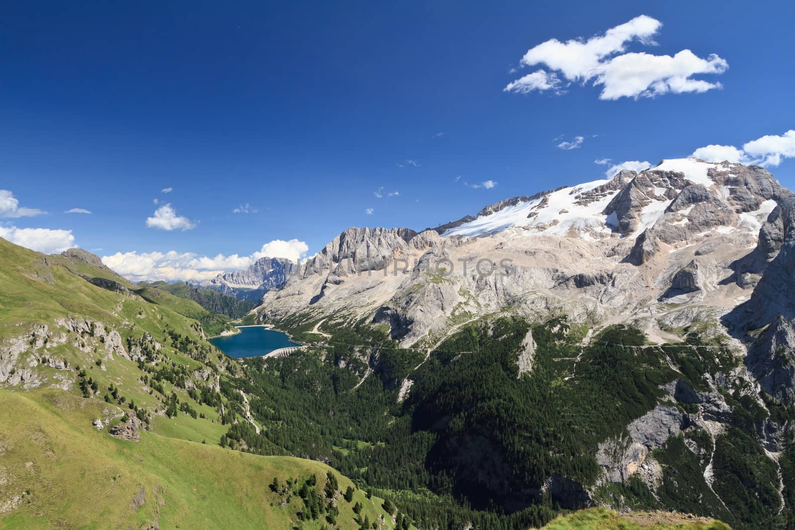 summer view of mount Marmolada and Fedaia lake, Trentino, Italy