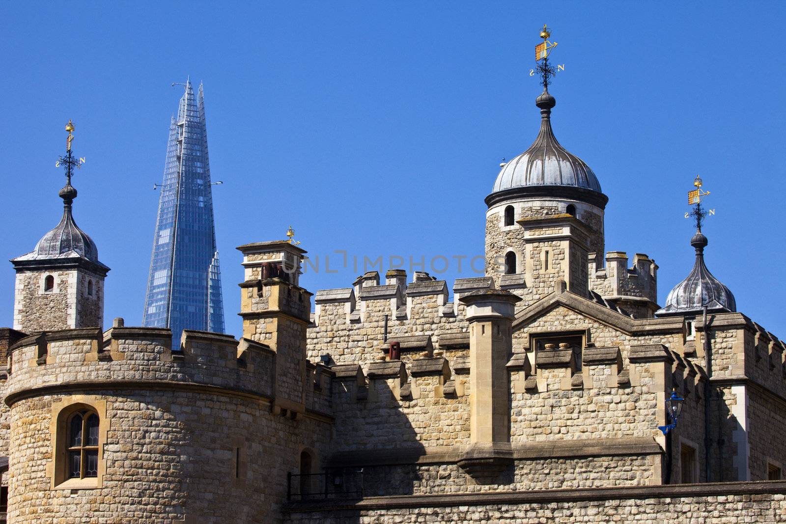 The historic Tower of London with the Shard in the background.