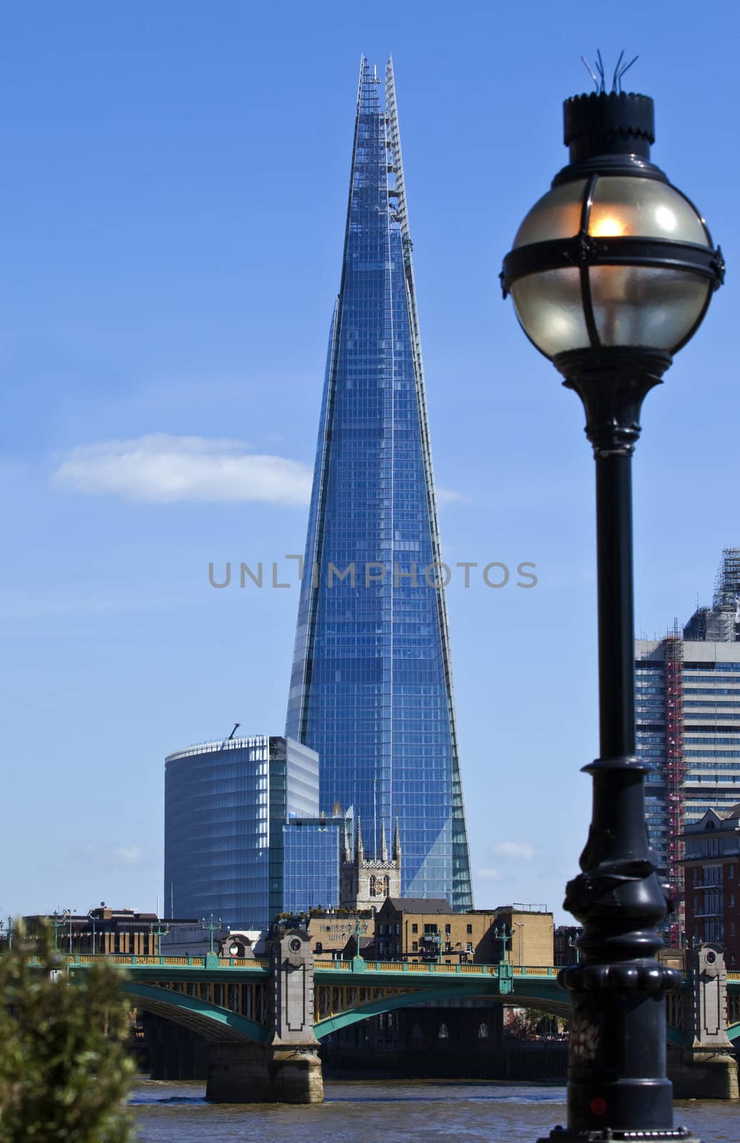 A view across the River Thames, taking in the sights of the Shard, Southwark Cathedral and Southwark Bridge in London.