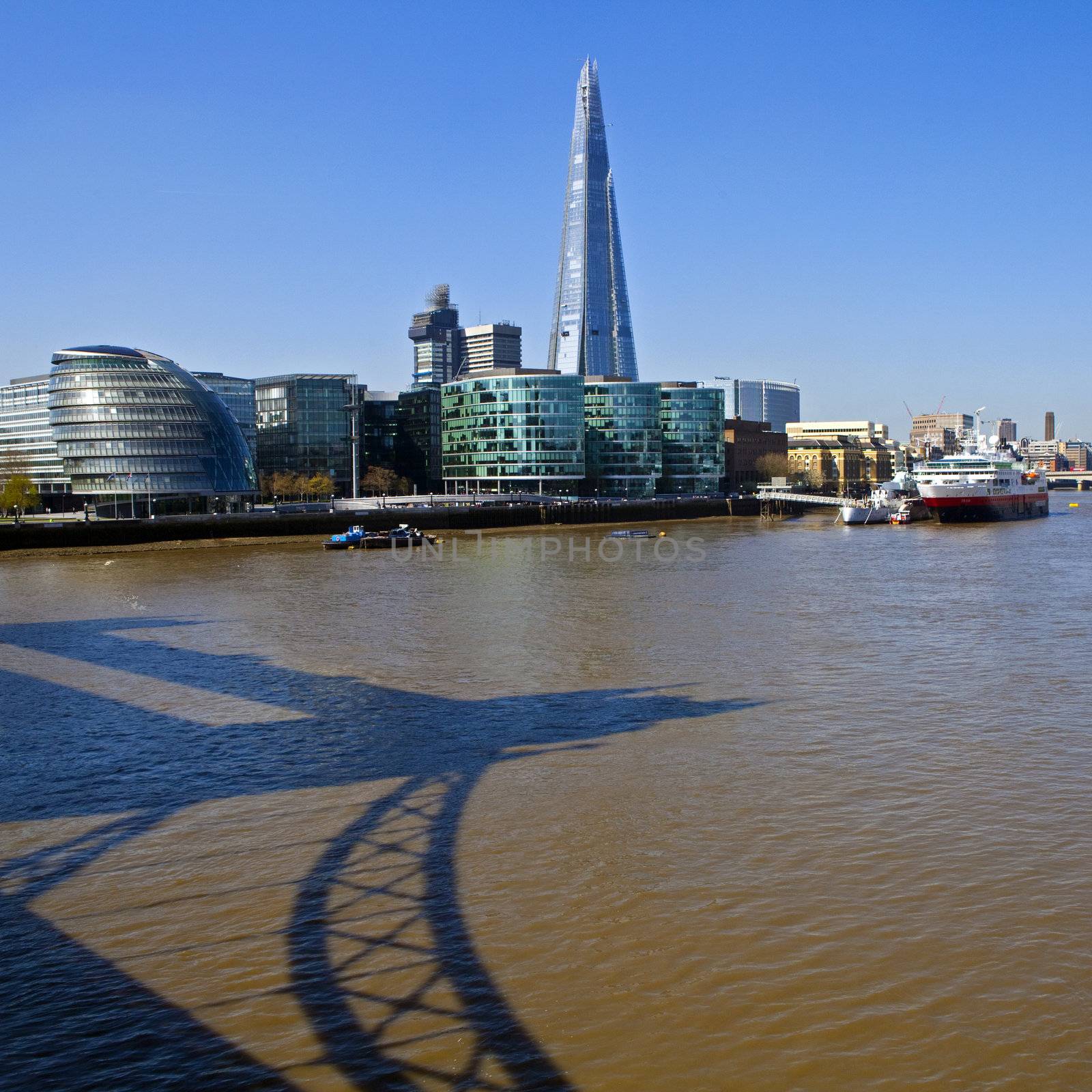 A view taking in the Shard, City Hall, the HMS Belfast and a shadow of Tower Bridge in the River Thames in London.