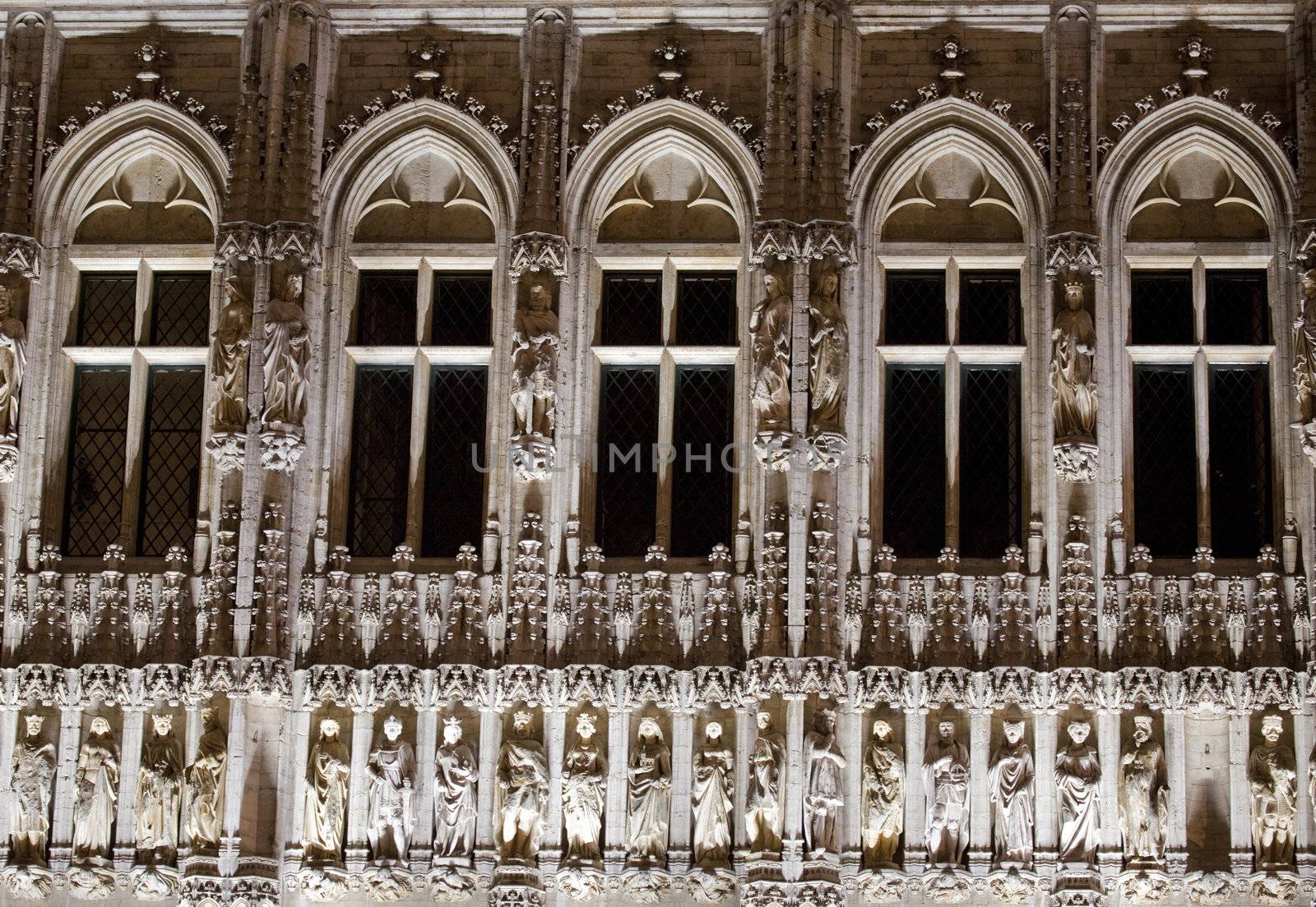 Close-up architectural detail of Brussels City Hall at night.