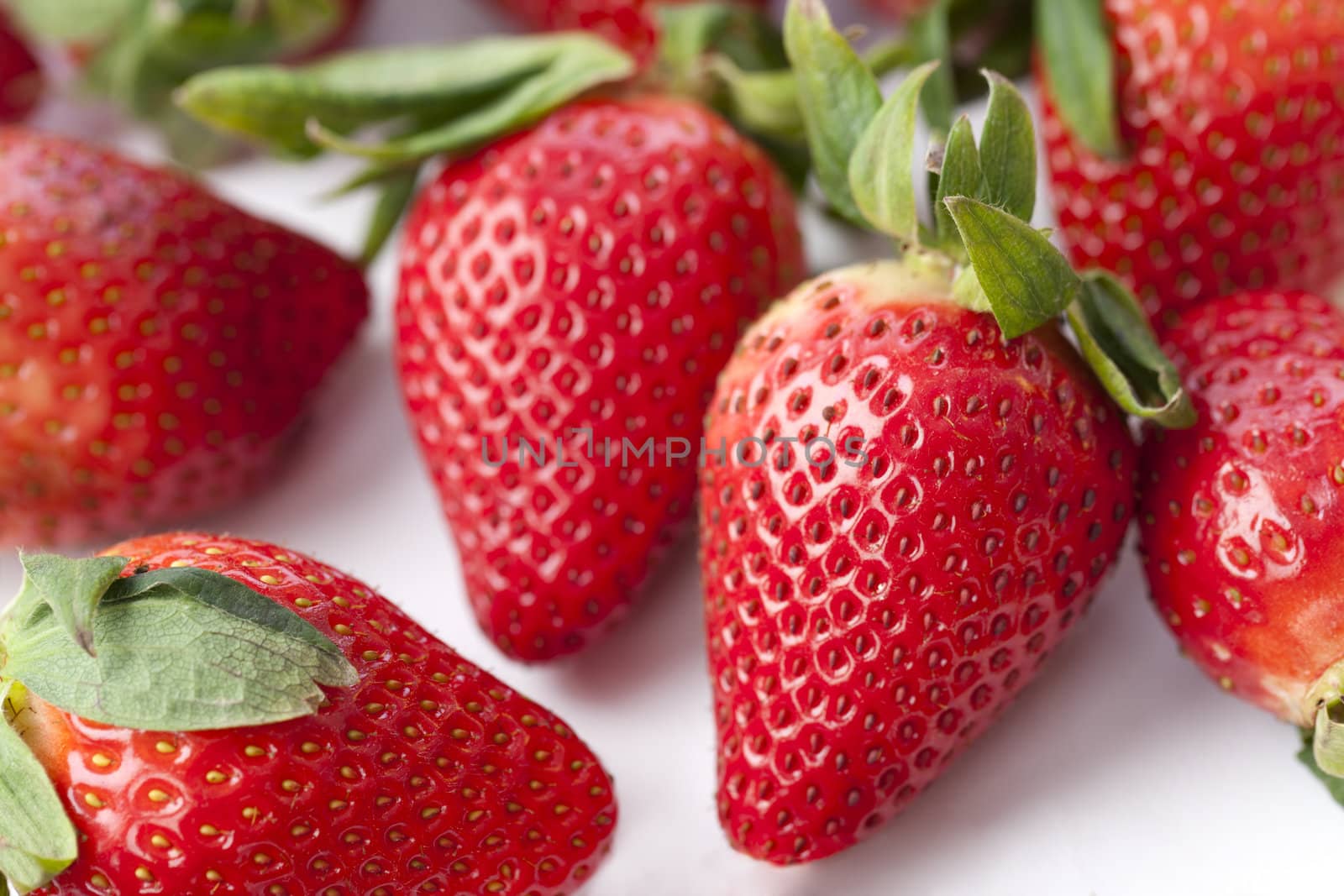 Sweet strawberries in a white background