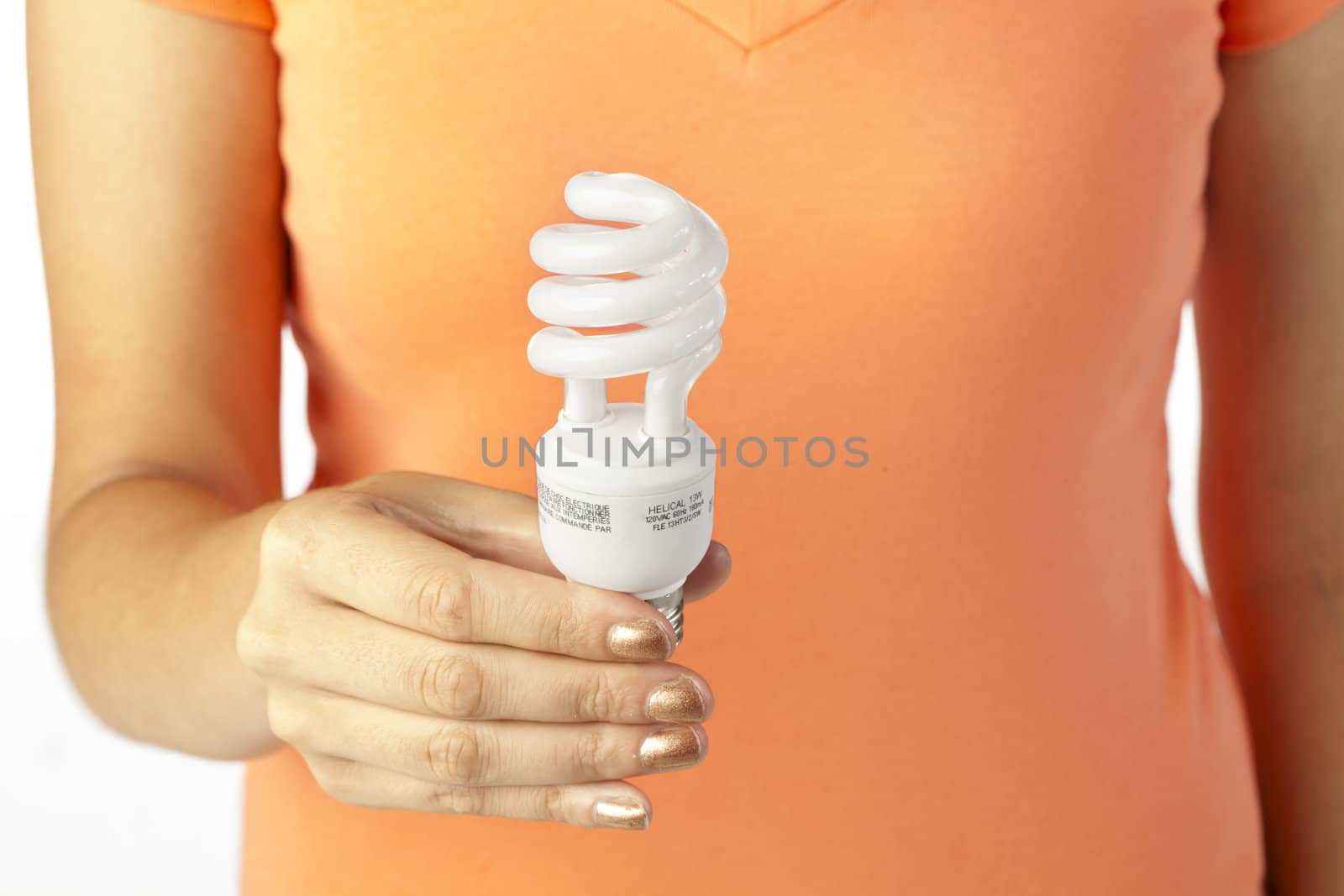 woman hand holding a light bulb by kozzi