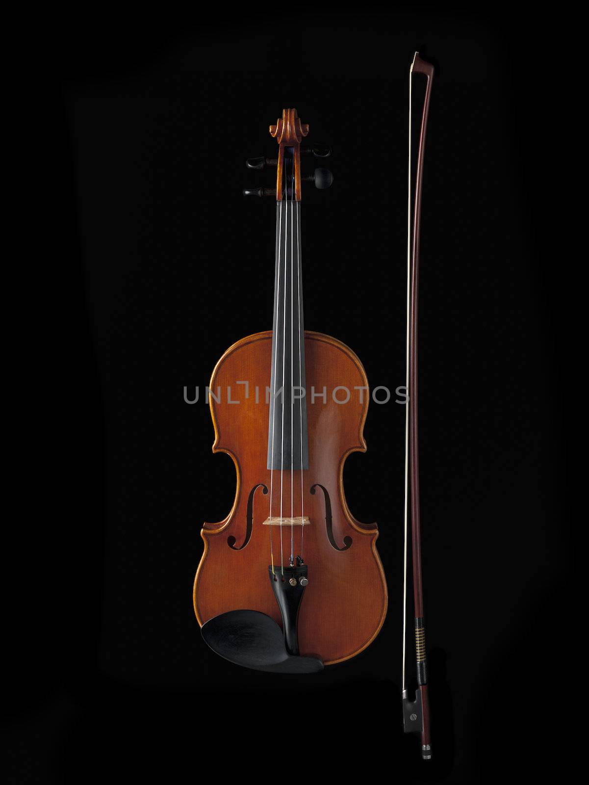 Violing and fiddle stick isolated on black background