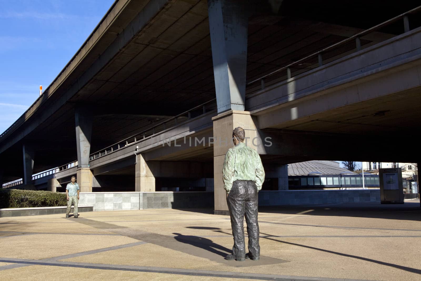 The Standing Man sculptures beside the Regents Canal, under the Westway in Paddington, London.