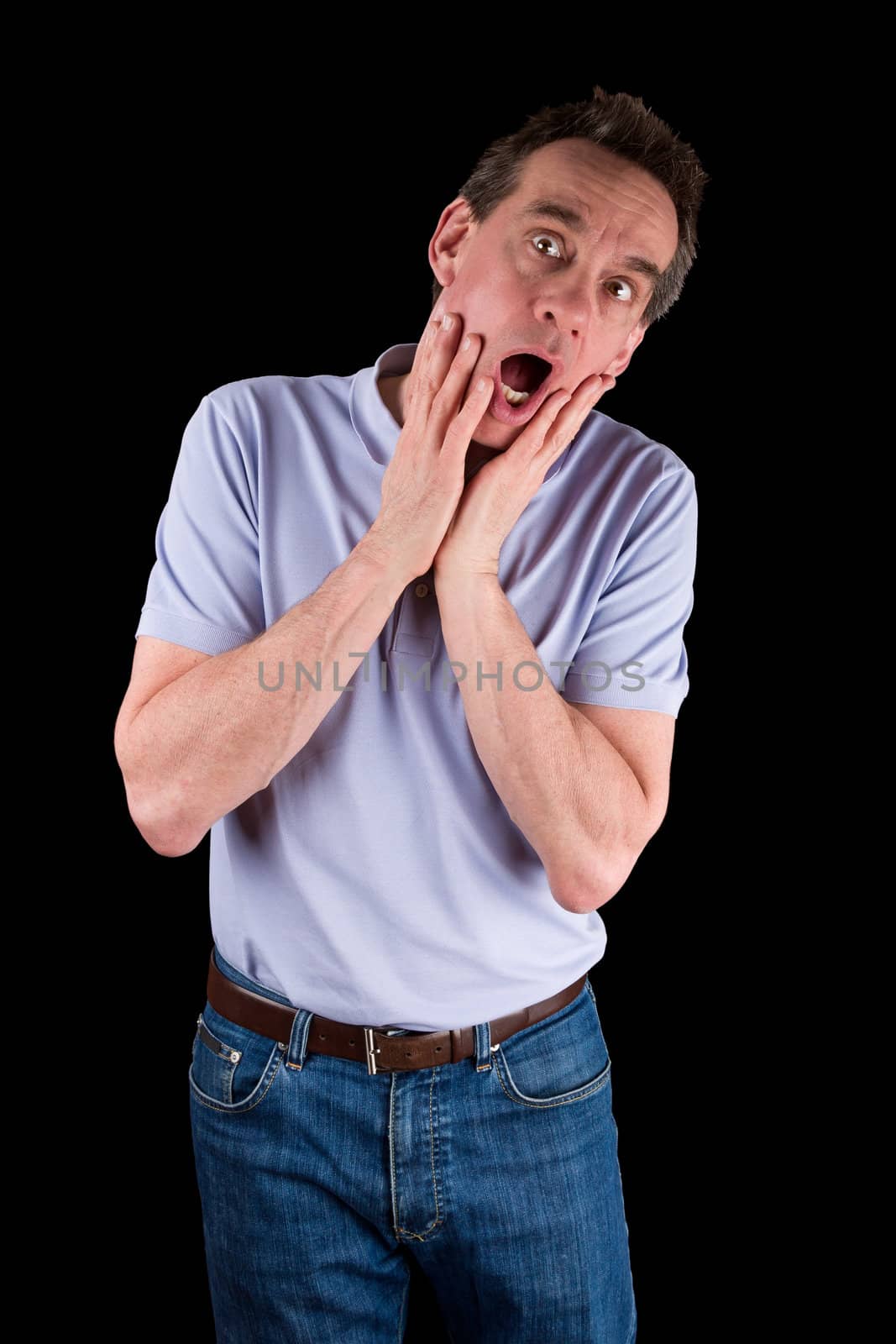 Middle Age Man Screaming in Horror Hands to Face Black Background