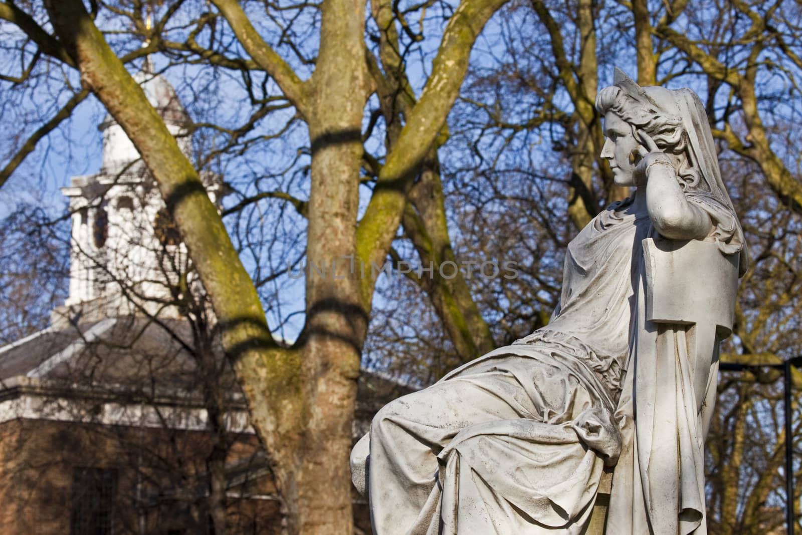 Sarah Siddons statue on Paddington Green with St.Mary's Church in the background, London.