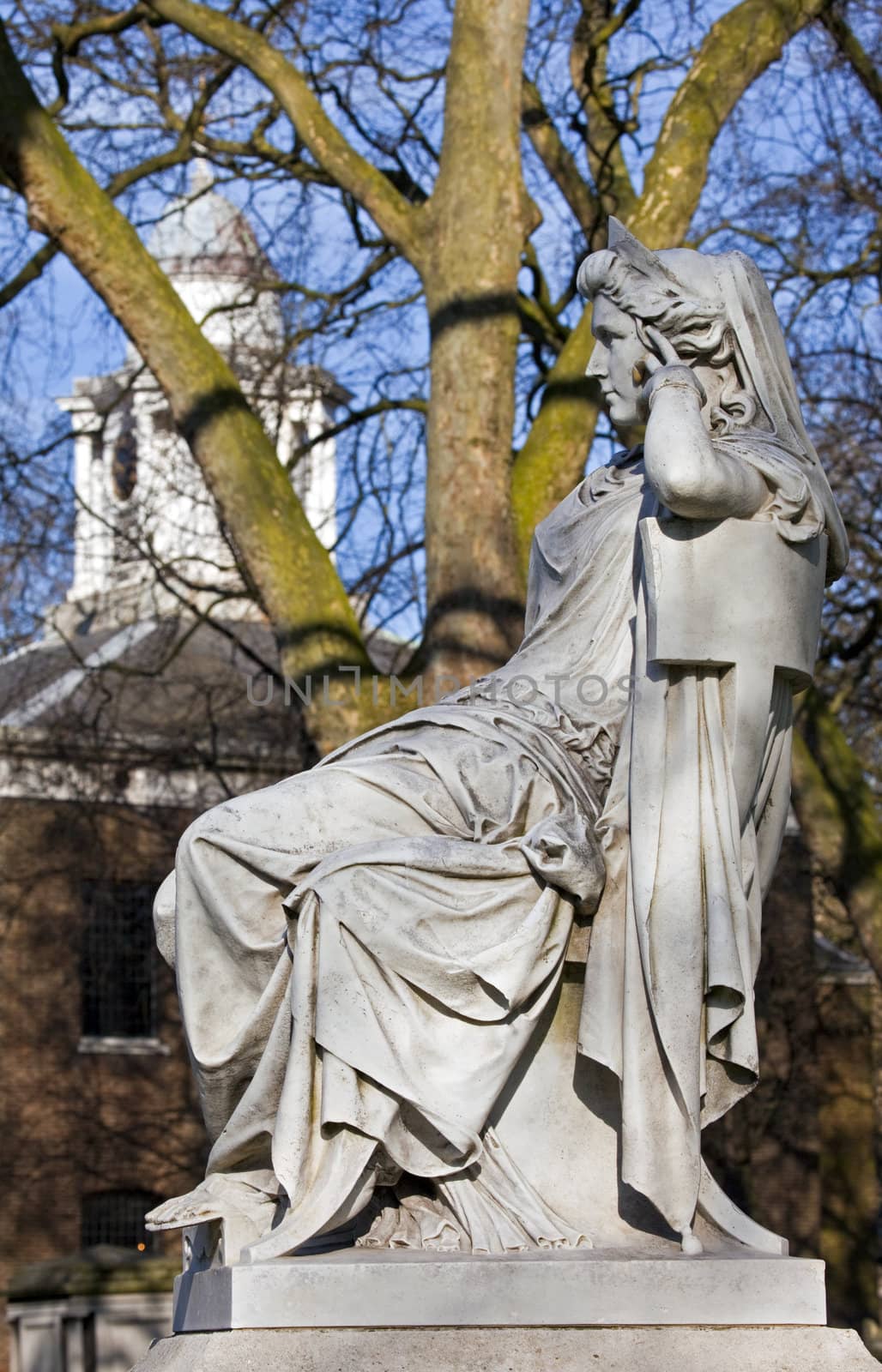 Sarah Siddons statue on Paddington Green with St.Mary's Church in the background, London.