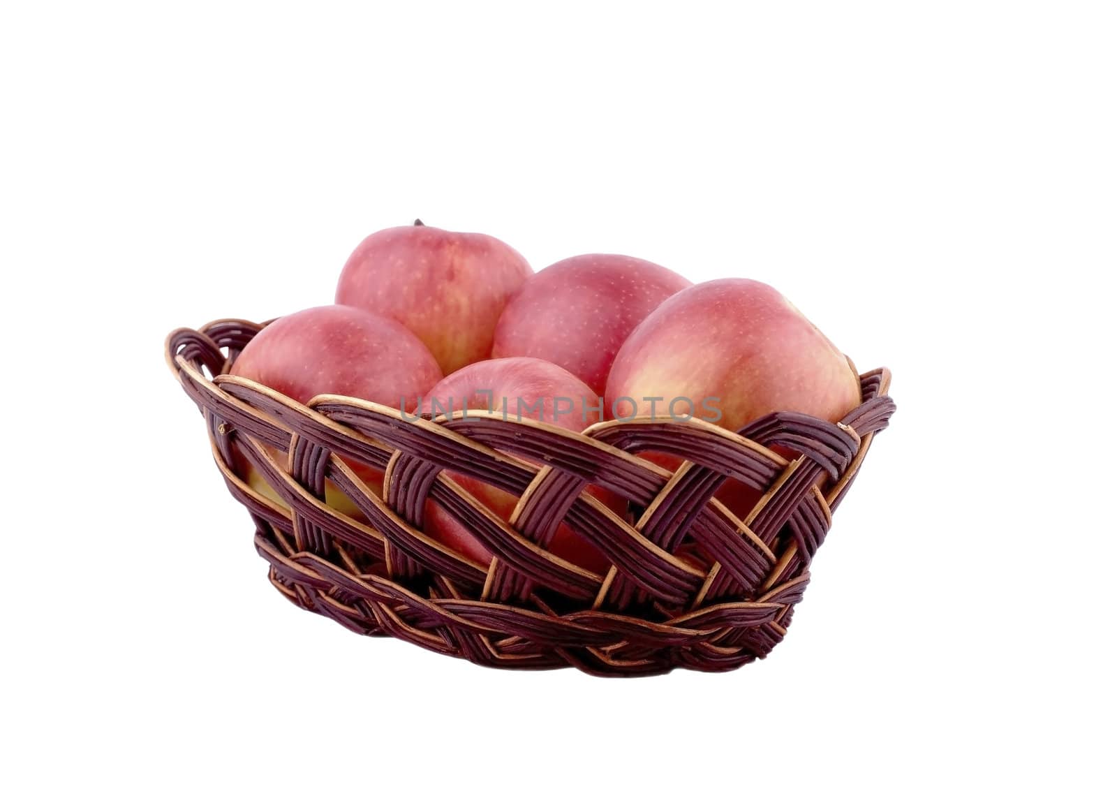 Red apples in a brown wicker basket on a white background