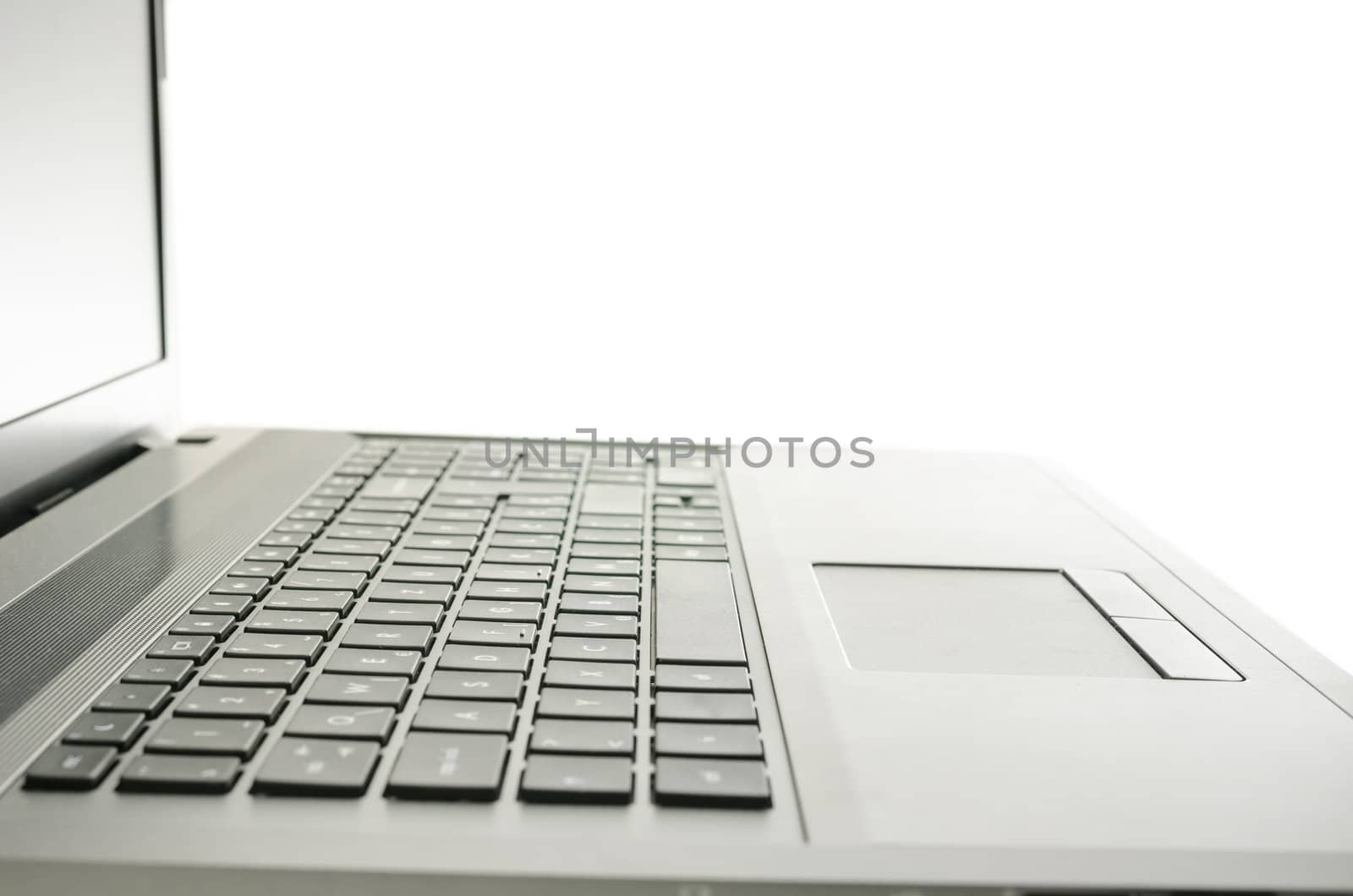 Closeup of laptop keyboard. Isolated over white background.