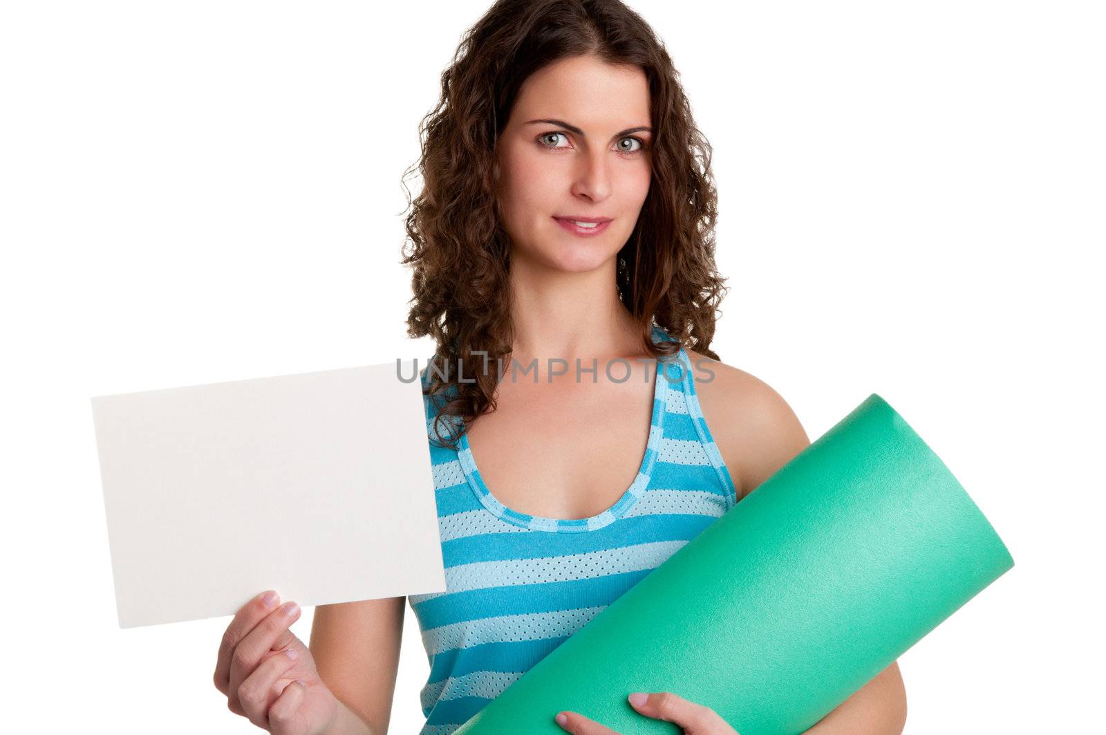 Woman holding a yoga mat and a white empty card, isolated in a white background