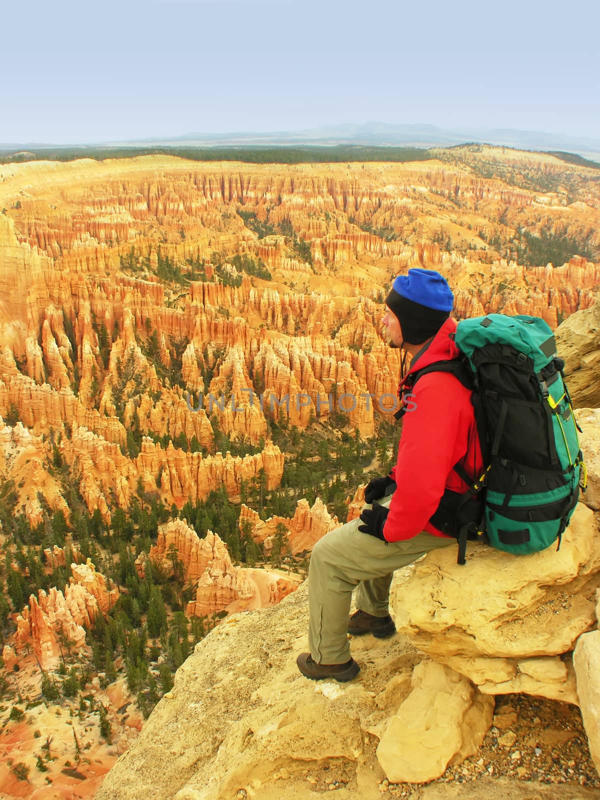 Backpacker resting at Inspiration Point, Bryce Canyon National Park, Utah, USA