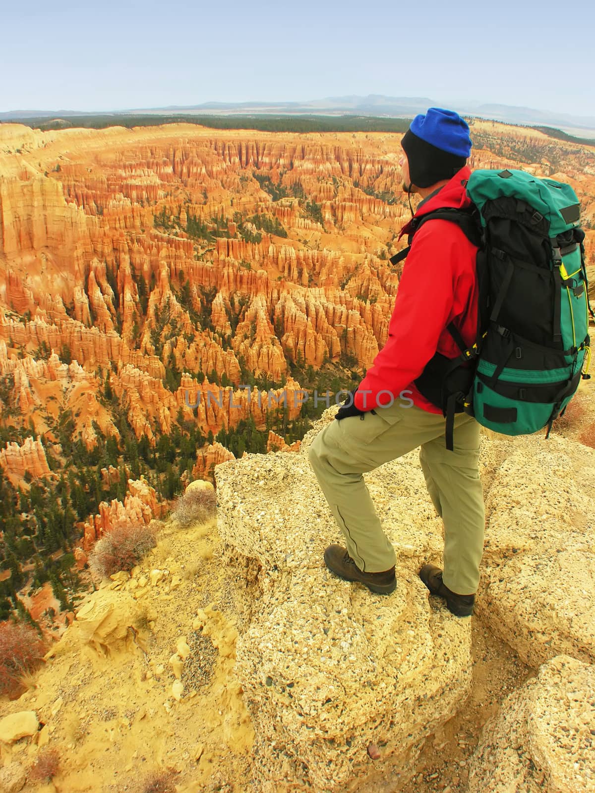 Backpacker resting at Inspiration Point, Bryce Canyon National Park, Utah, USA