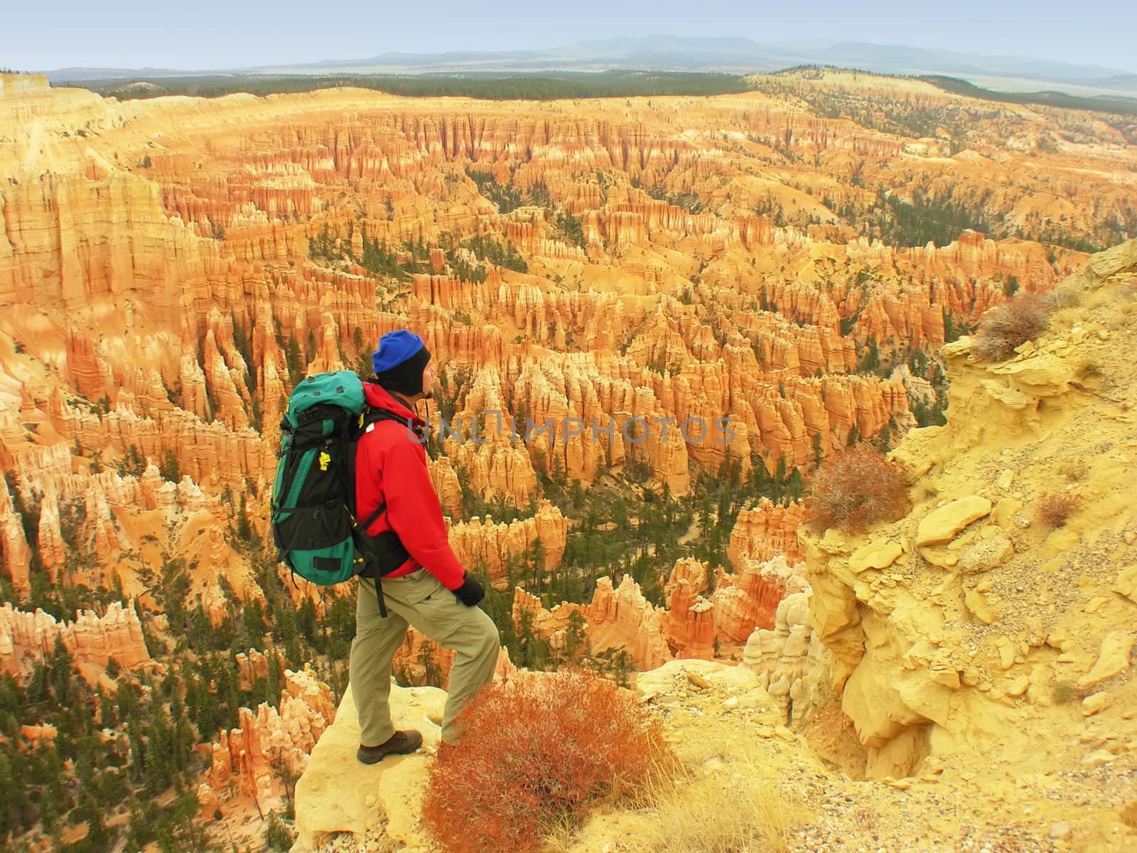 Backpacker resting at Inspiration Point, Bryce Canyon National Park, Utah, USA