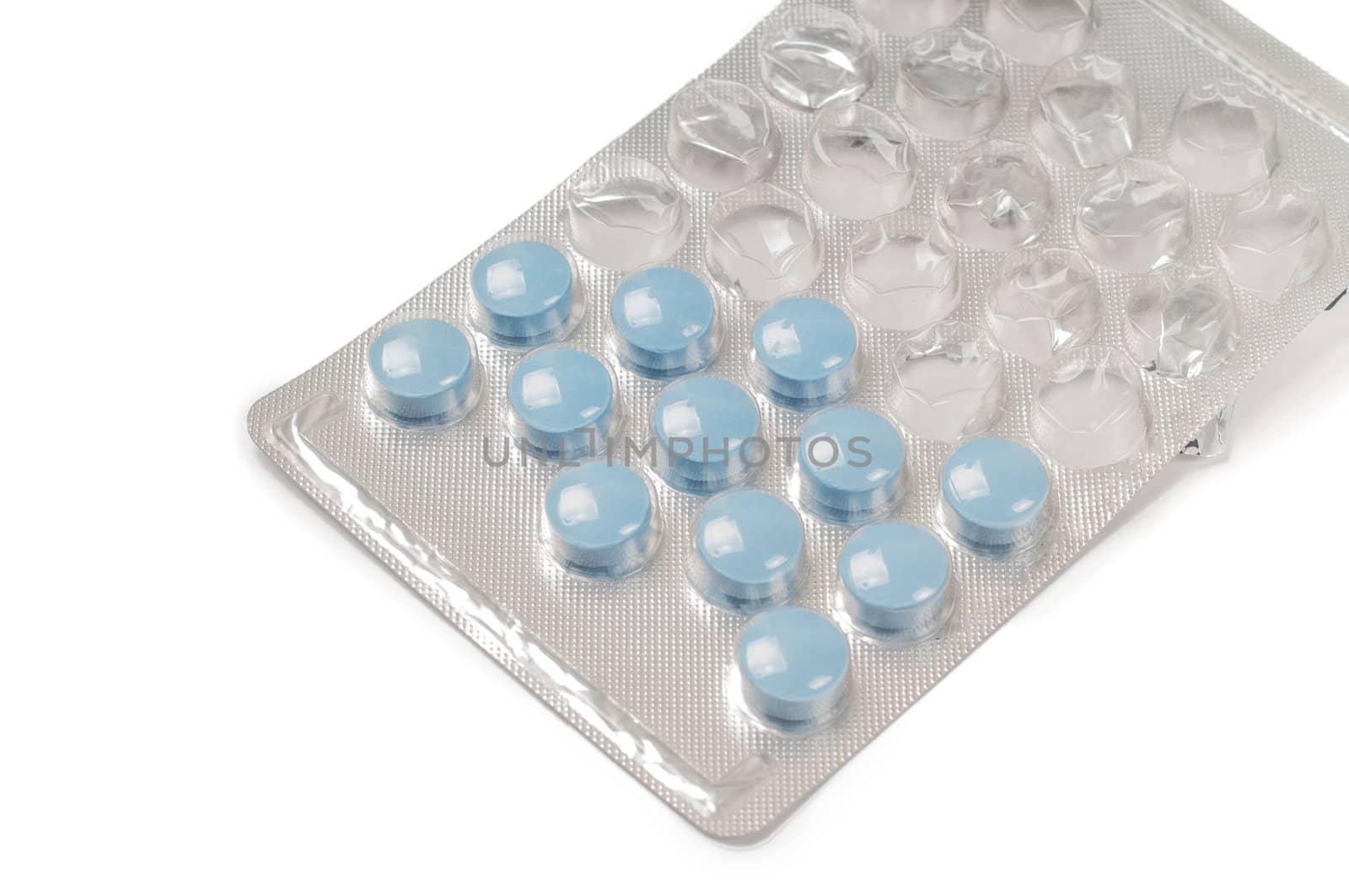 Shot of blue drugs (tablets) isolated on white