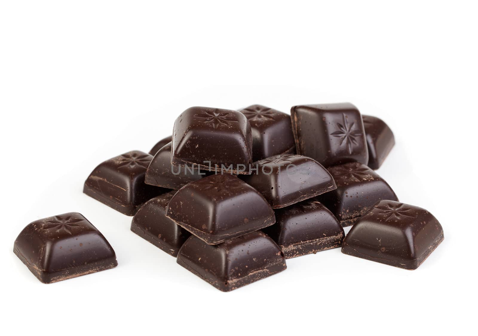 Delicious dark chocolate pralines isolated on white