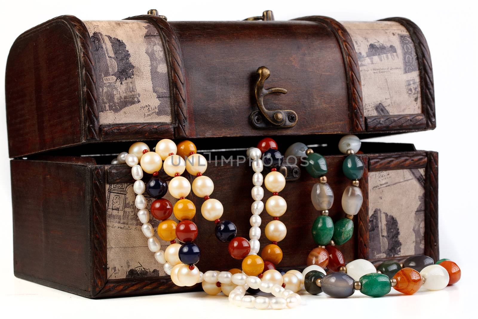 Brown chest with treasures isolated on white