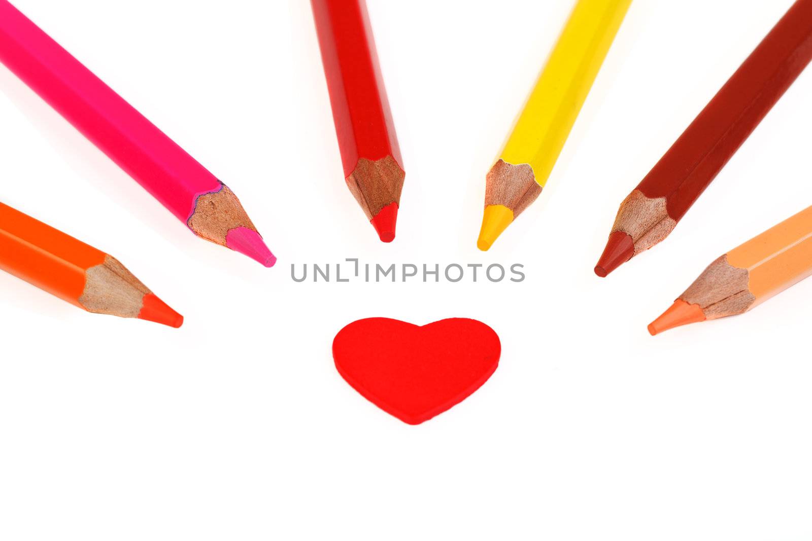 Colorful pencils and heart isolated on white by mdmmikle