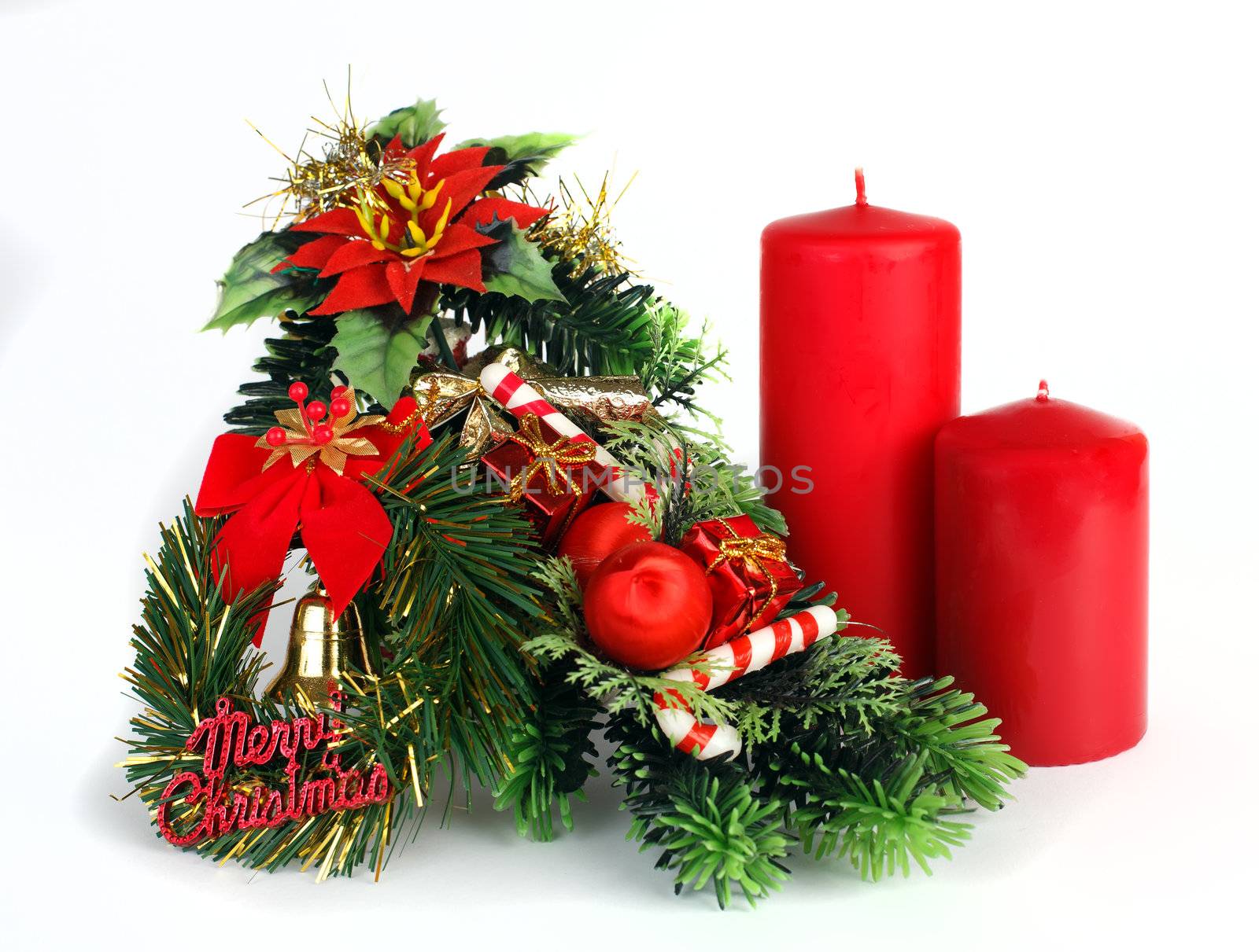 Christmas decoration with two red candles on white background by mdmmikle