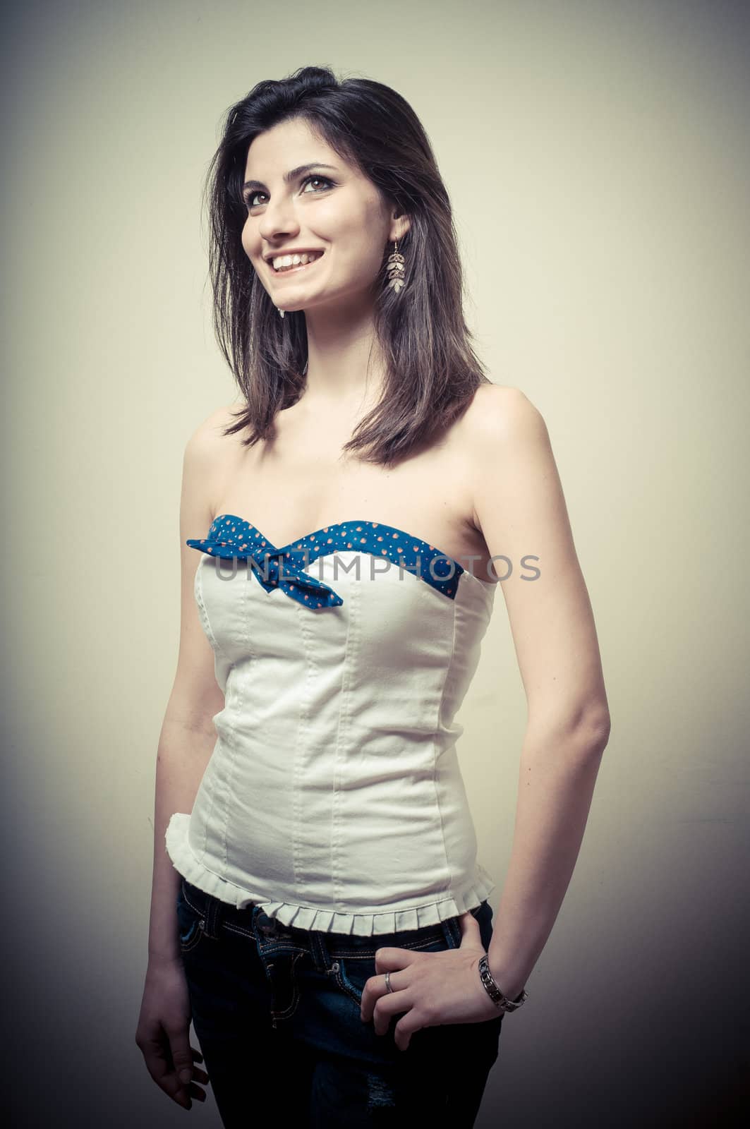 vintage portrait of young woman on vignetting background