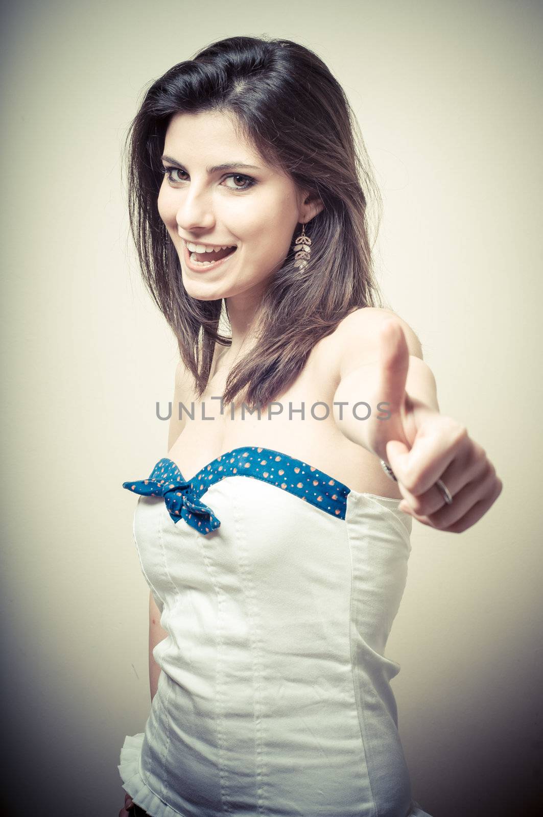 vintage portrait of young woman doing ok on vignetting background