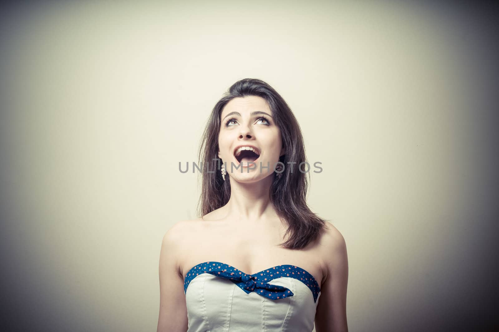 vintage portrait of young woman crying on vignetting background