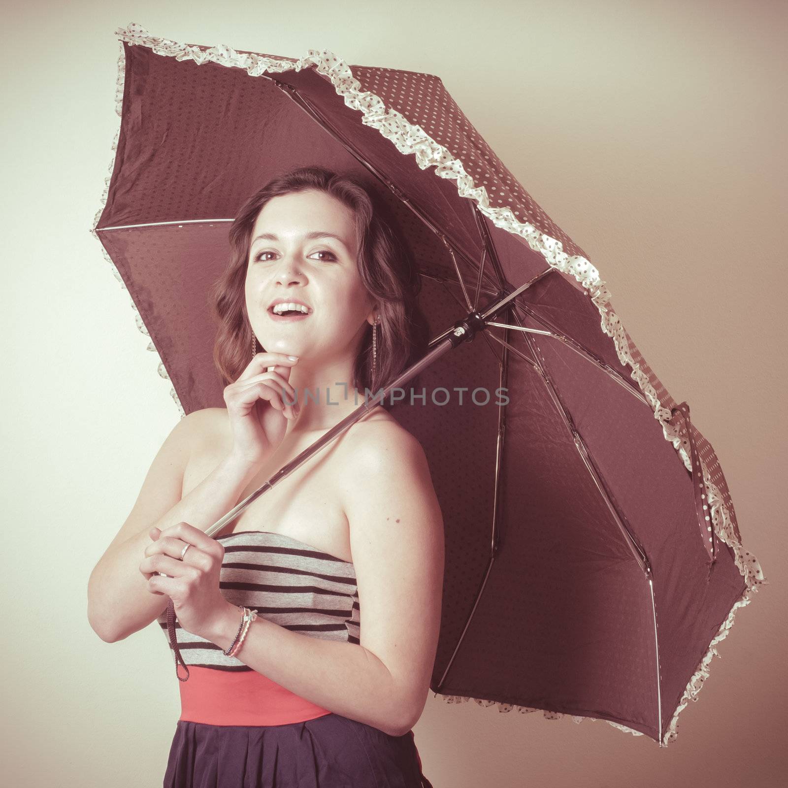 vintage portrait of young woman with umbrella by peus